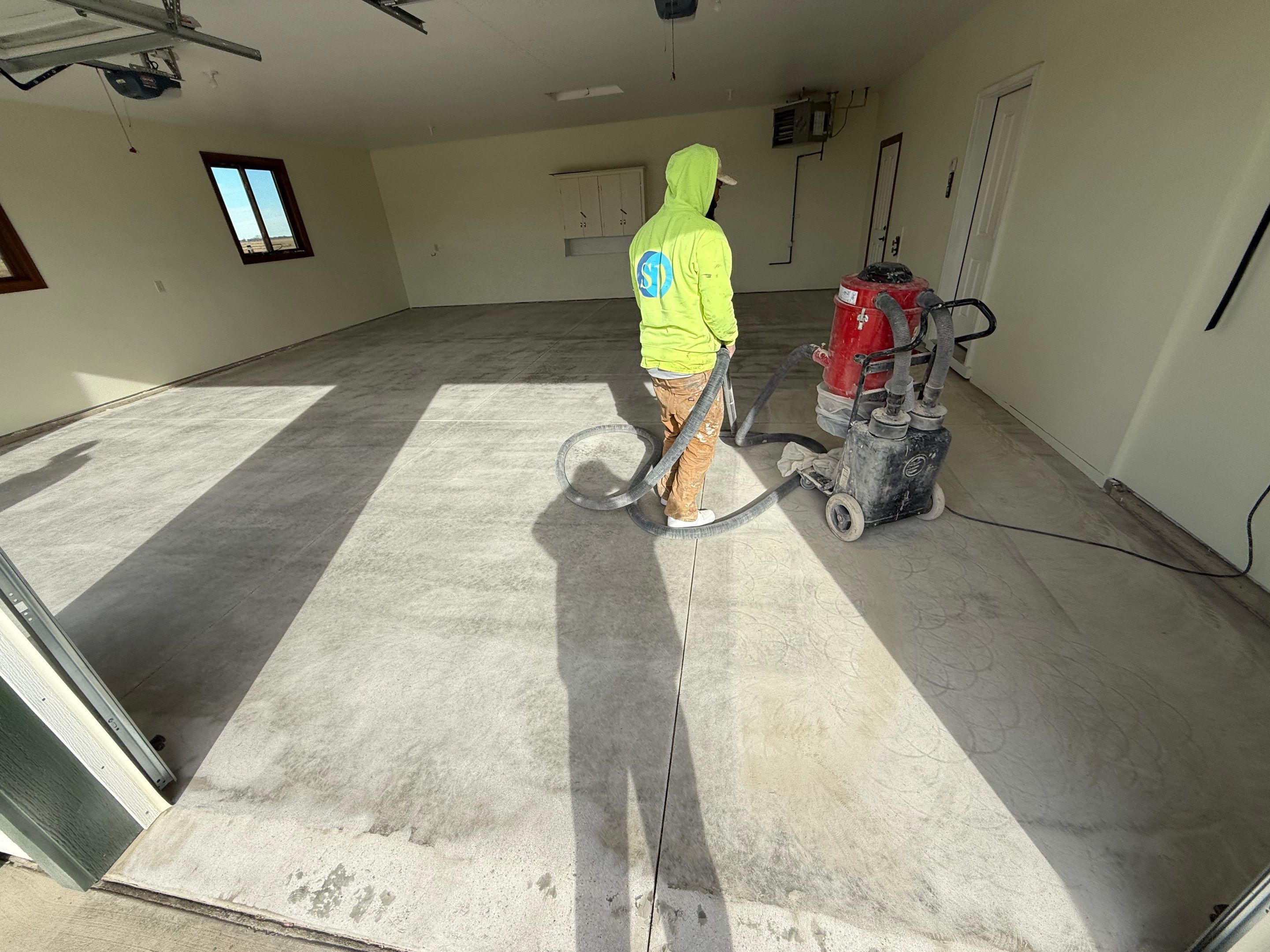 Speckled Epoxy Garage Floor Coating and Concrete Repair in Lennox by Select Painting, Coatings & Garage Cabinets