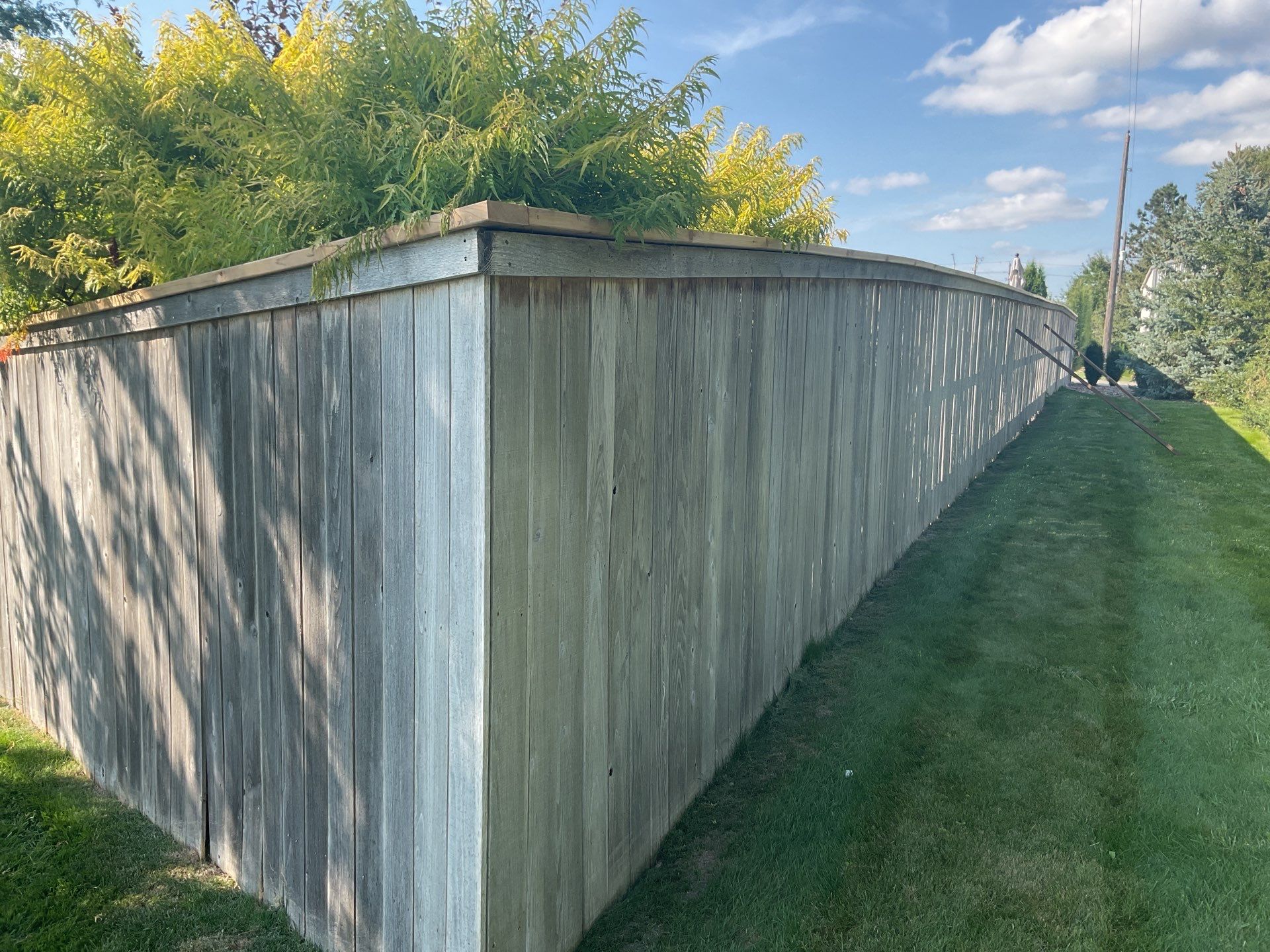 Custom Privacy Fence and Paver Patio Installation in Sioux Falls by Select Painting, Coatings & Garage Cabinets