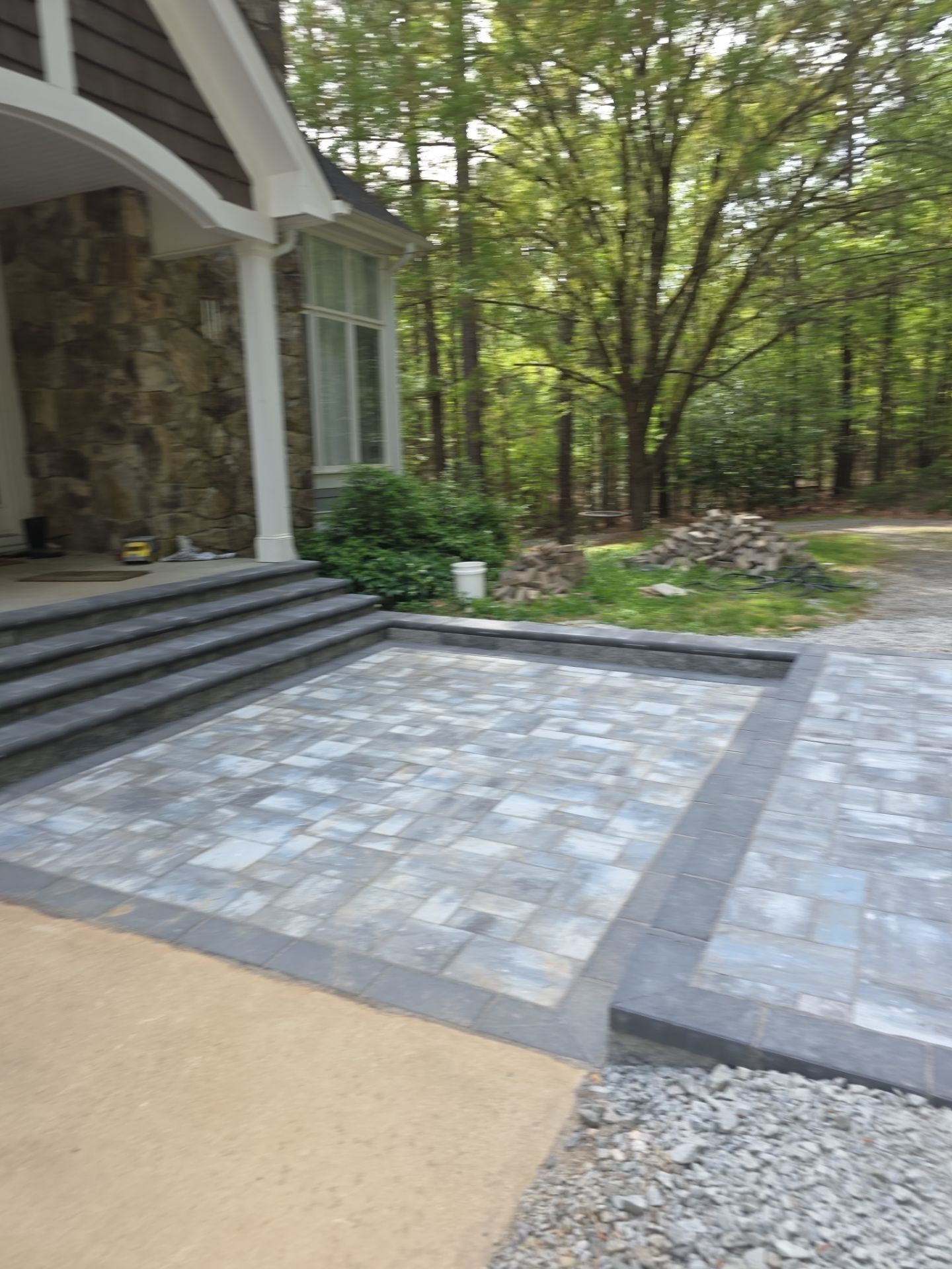 Pittsboro Outdoor Living Transformation – Retaining Wall, Paver Patio & Elevated Deck by Elite Remodeling and Design LLC