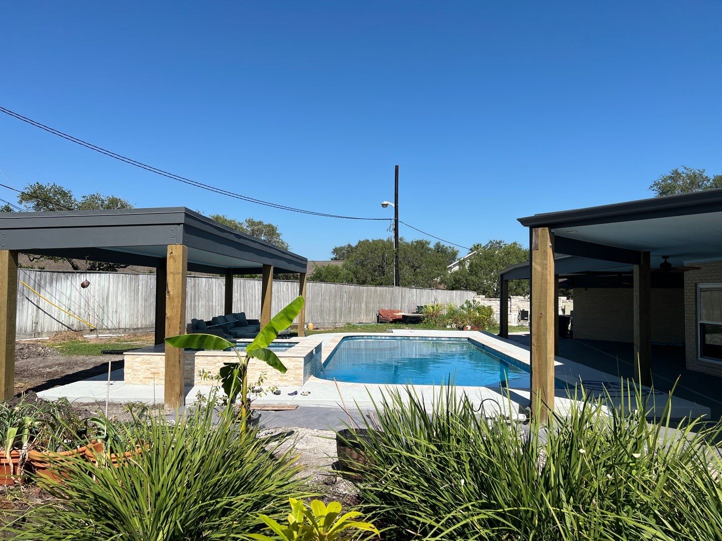 Beautiful pool side build by Bayfront Roofing and Construction