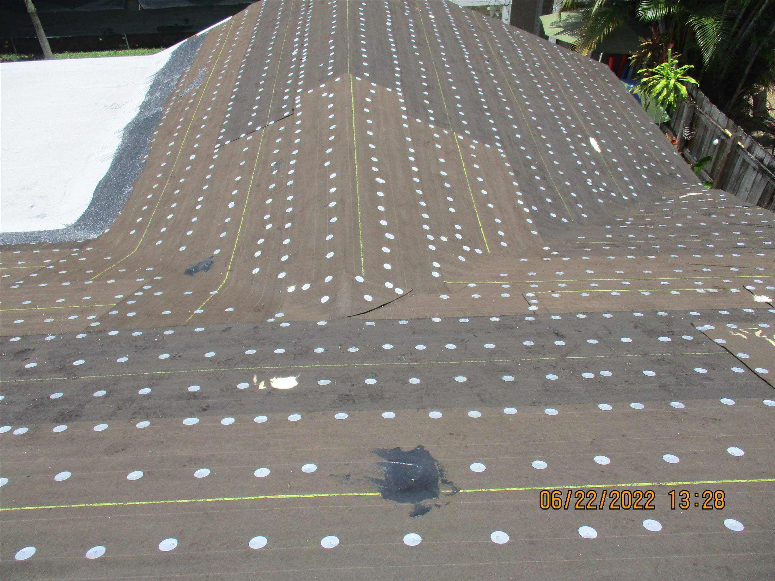 Residential Roofing Installation using 1.5" Nail Strip 24ga Solar White Kynar Coated Standing Seam Metal Panels by Morton Roofing, Inc.