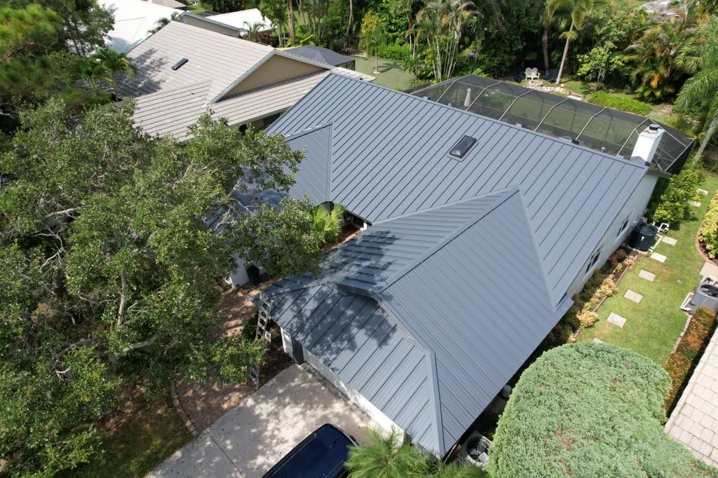 Standing Seam Metal Charcoal Grey Roof Replacement and Skylight Installation in Jupiter by Art's Roofing & Construction