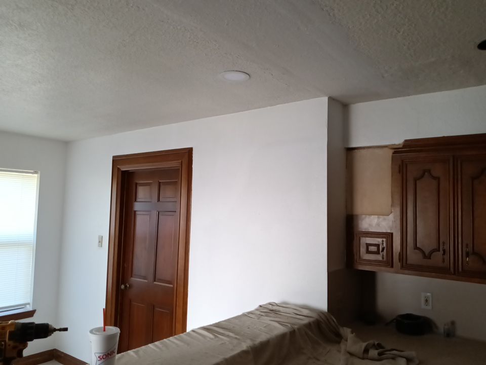 Interior and exterior painting project by Roof Concepts Construction