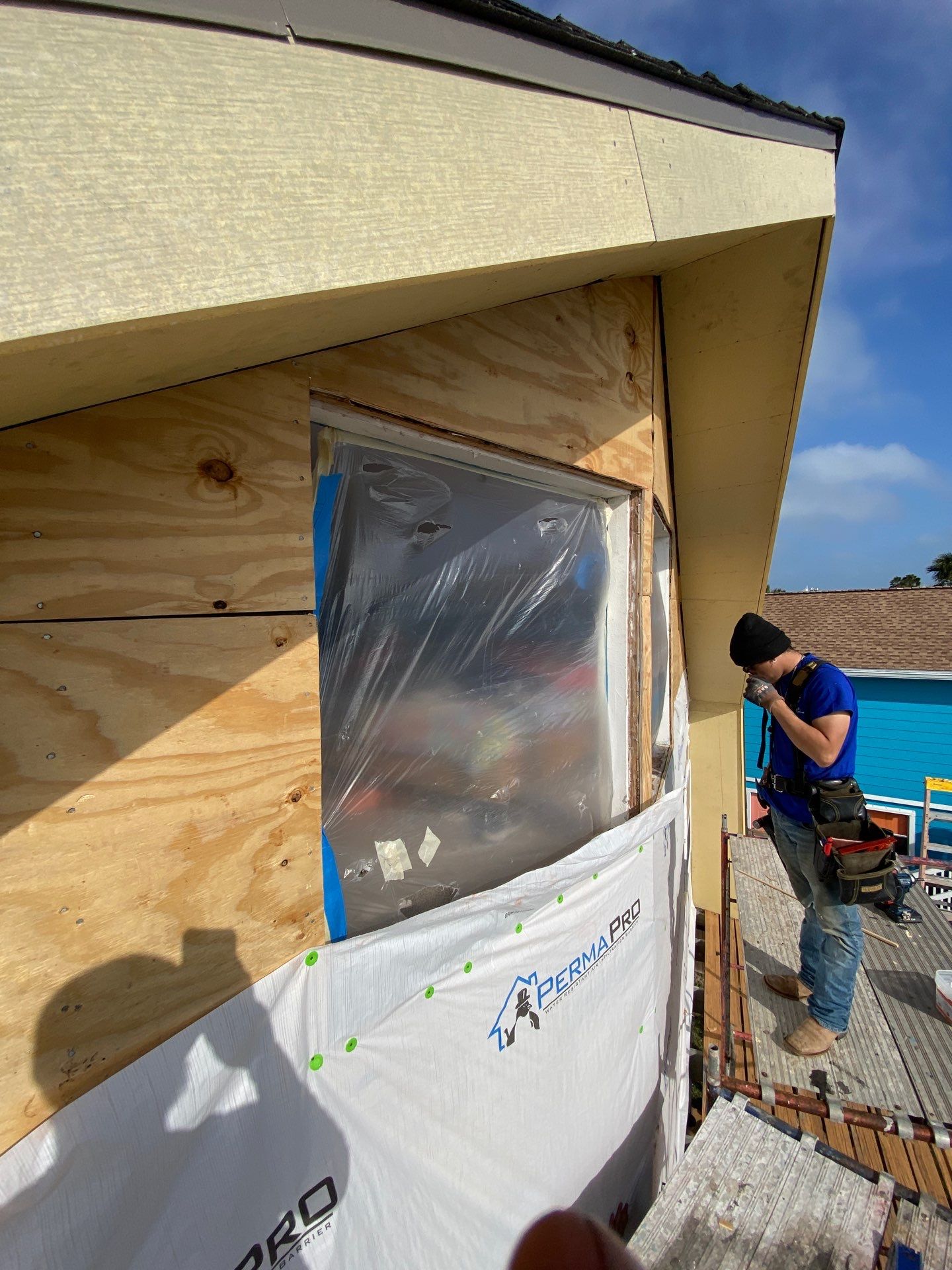 Installing Windows on a Submarine  by Bayfront Roofing and Construction