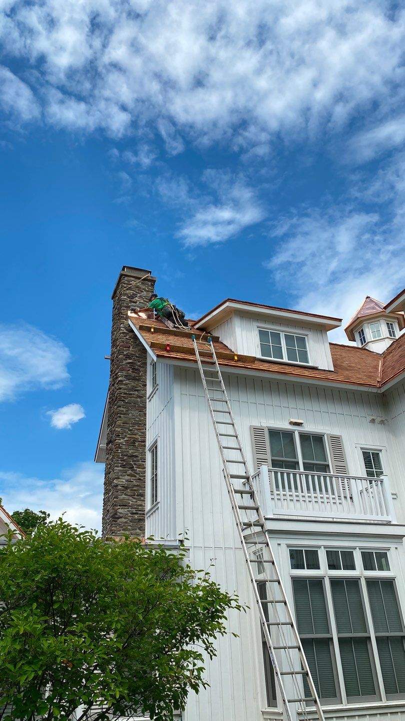 Cedar Shake Roof Replacement with Half Round Gutter Installation by Custom Installations