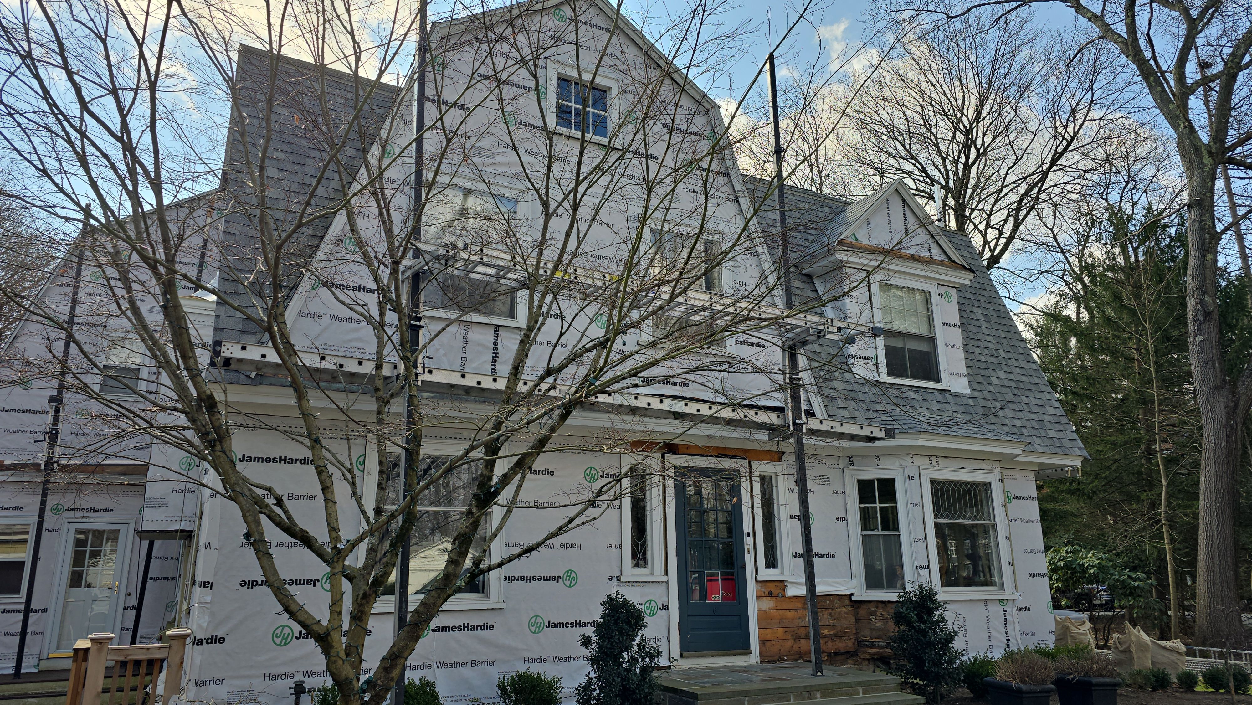 White cedar shingles and windows in Wayland, MA by UBrothers Construction