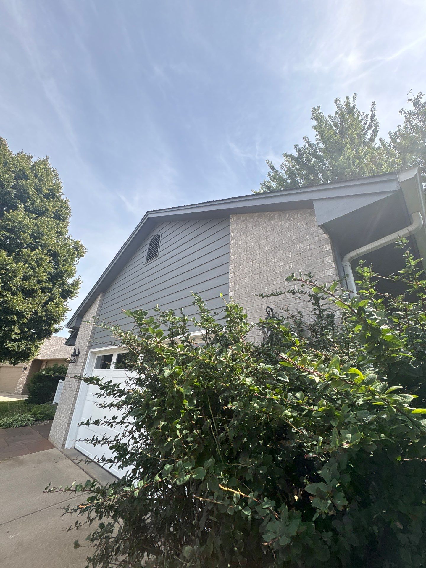 Full Exterior Painting for Gray Siding and Trim in Sioux Falls by Select Painting, Coatings & Garage Cabinets