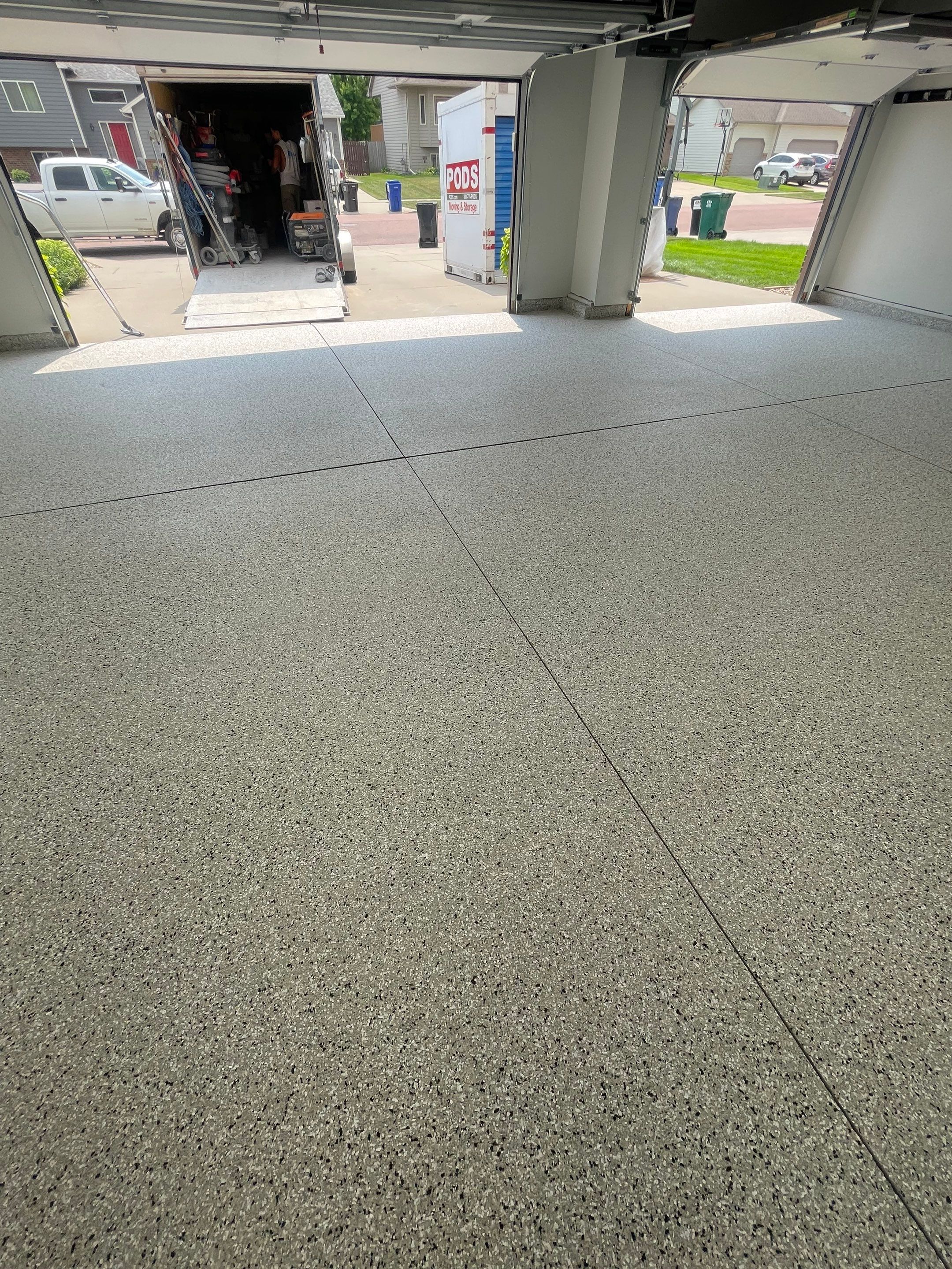 Multi-Car Garage Floor Coating and Crack Repair in Tea by Select Painting, Coatings & Garage Cabinets