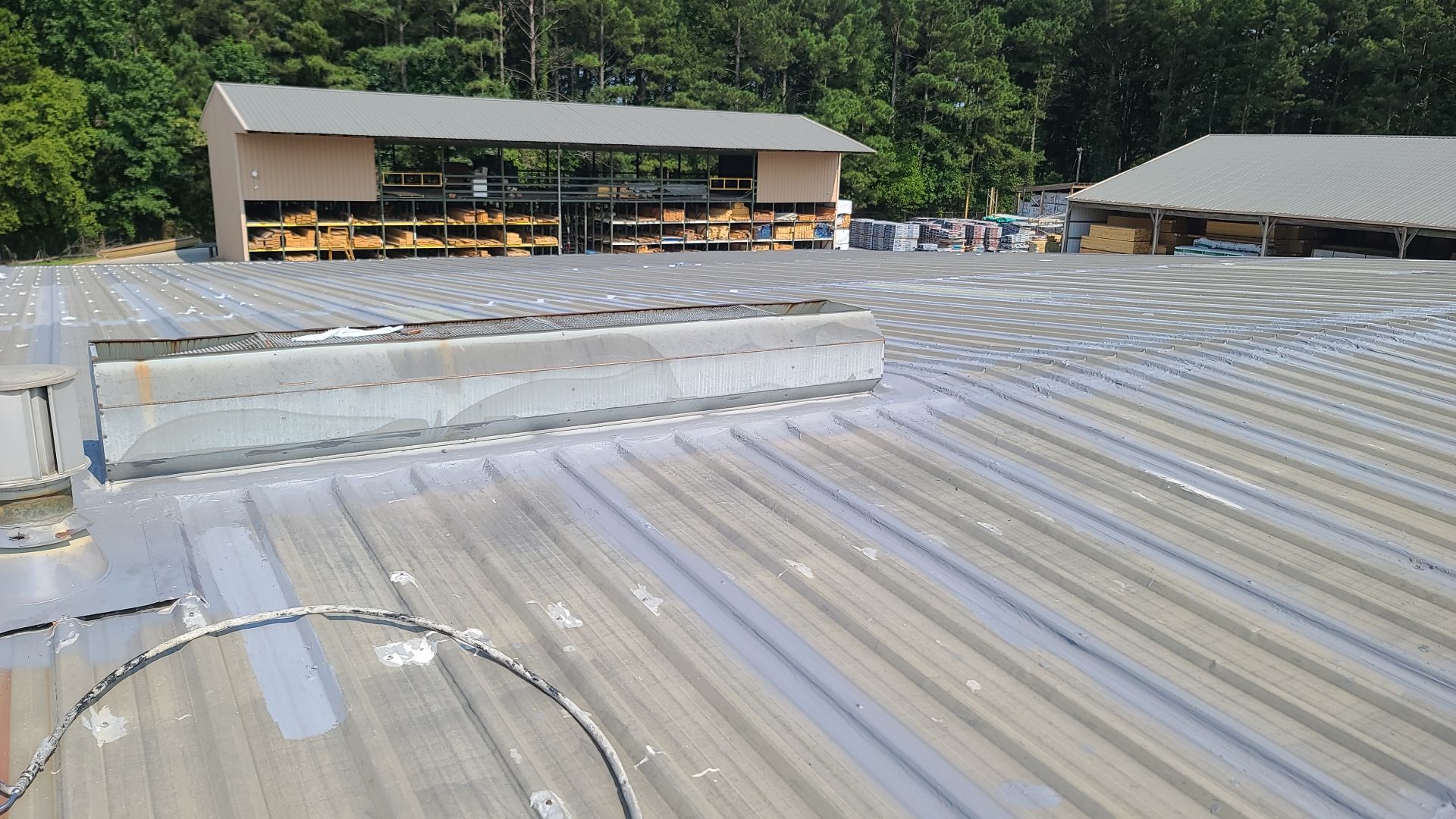Commercial Roofing Installation using Aldocoat Coatings by Hostetler Roofing