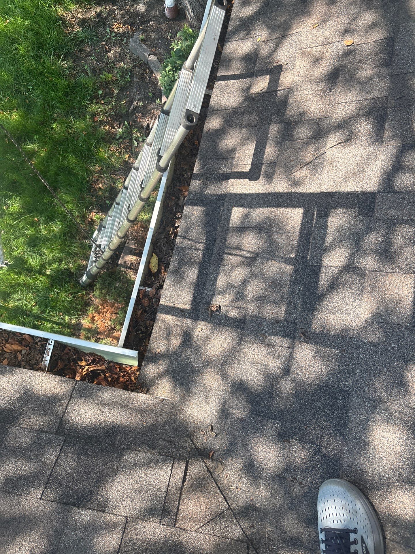 Commercial gutter cleaning Iowa City, IA before photo with filled gutters