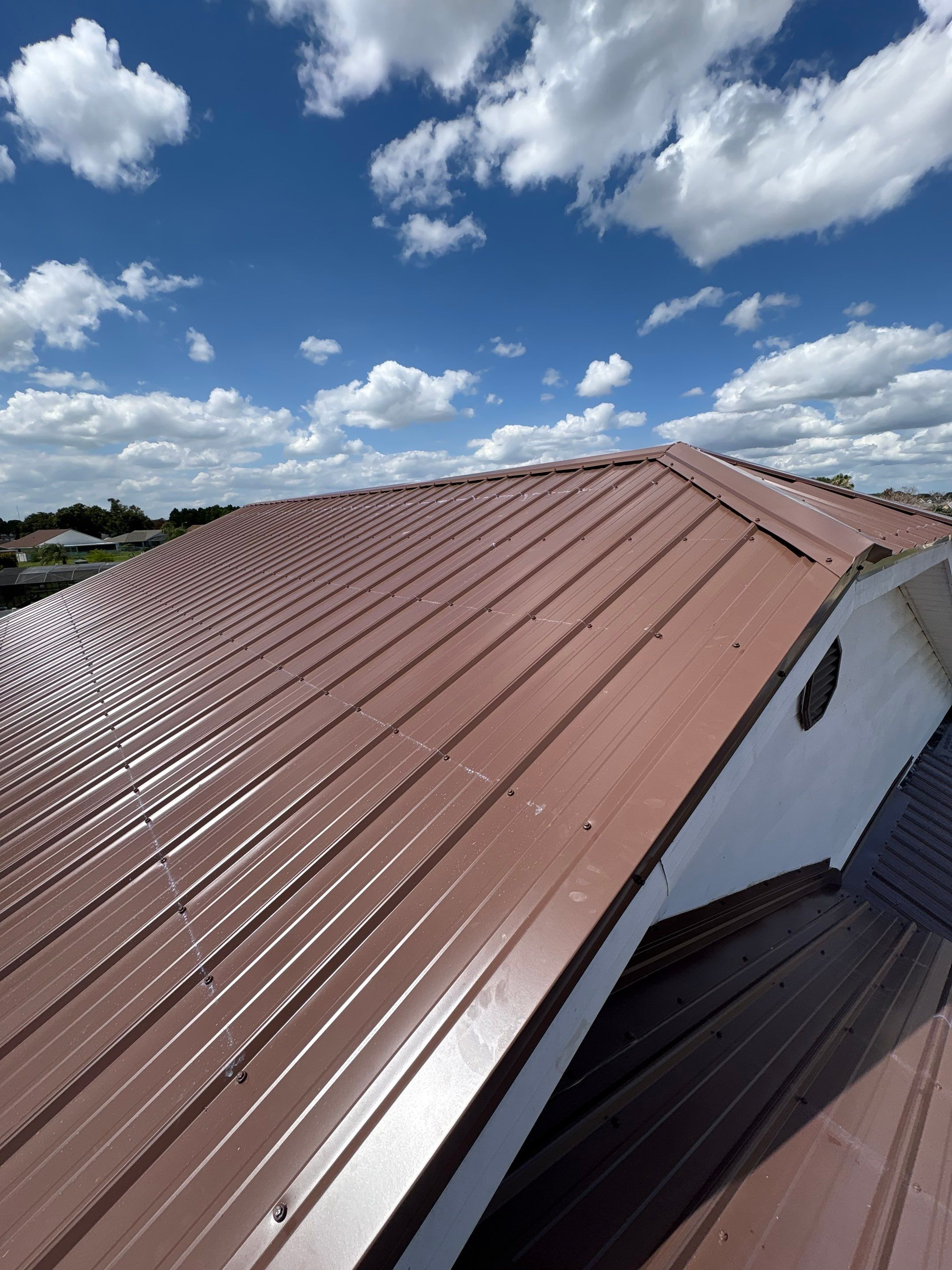 Residential Metal Roofing Installation and Gutter Replacement in Kissimmee by Pinnacle Roofing Group