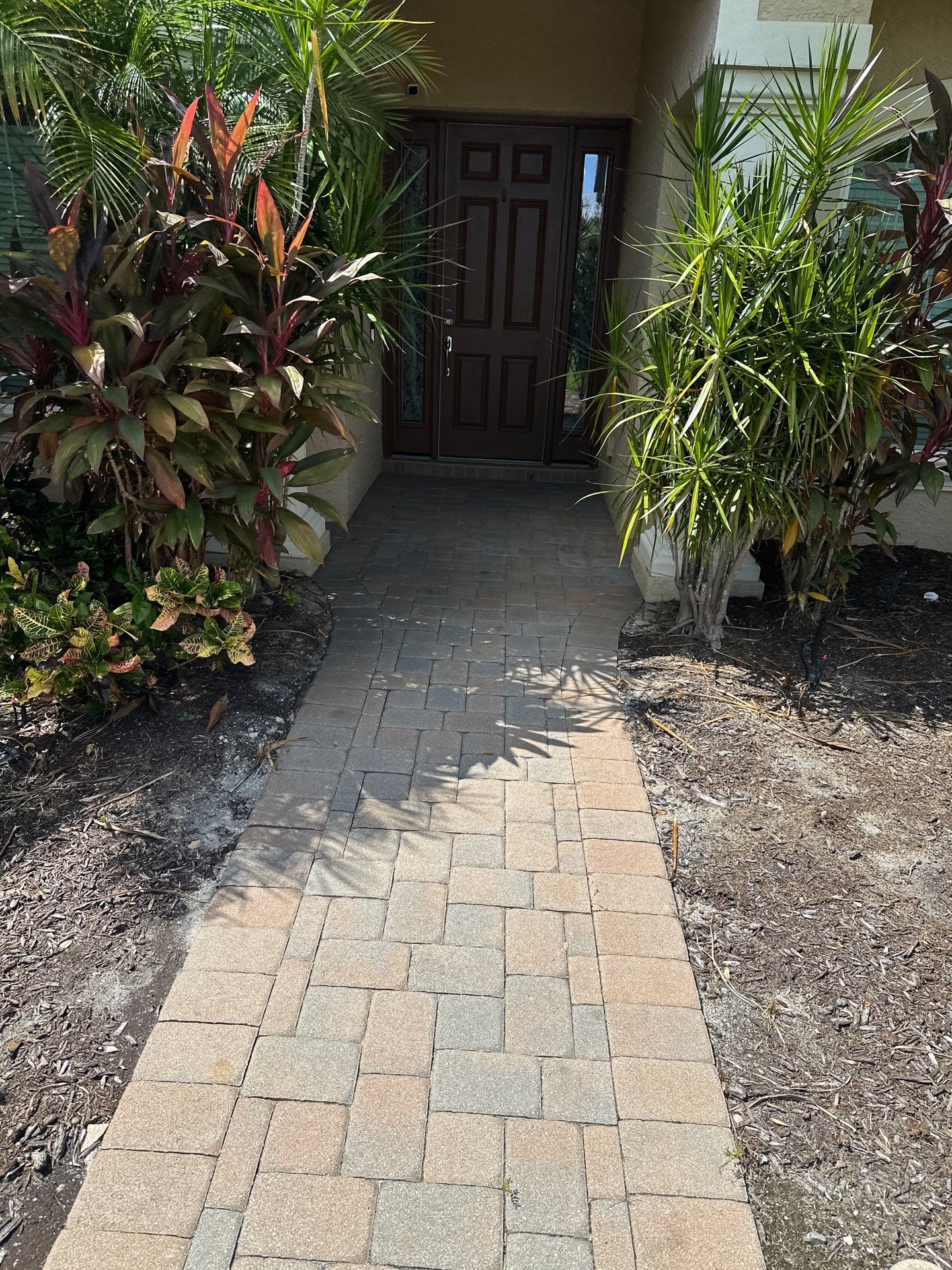 Paver Driveway, Entryway, Sidewalk, and Street Curbing Cleaning in Winding River Community, Bradenton, FL by Sunshine AquaWash
