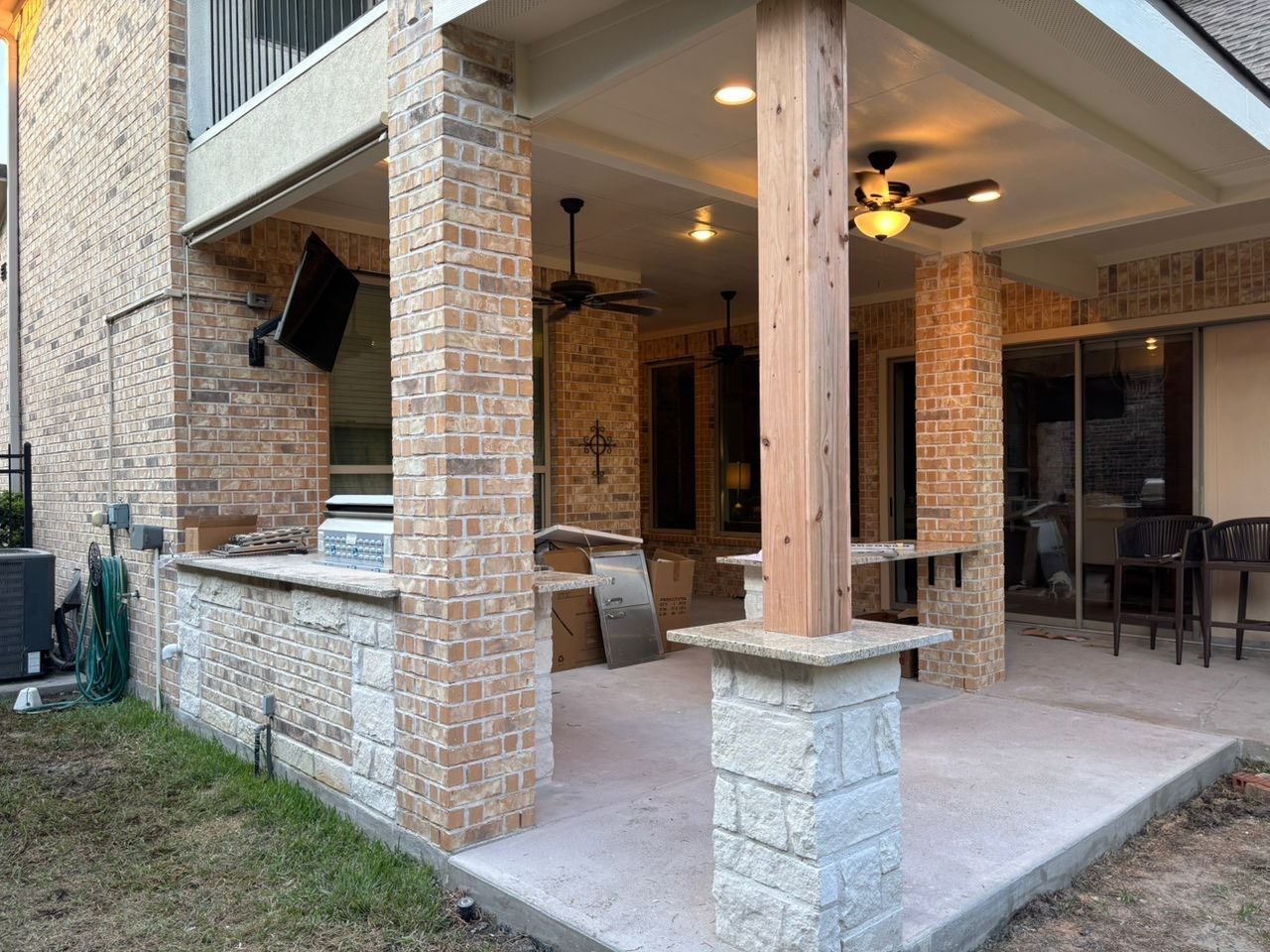 Patio Extension for Outdoor Kitchen by Houston Roofing & Construction