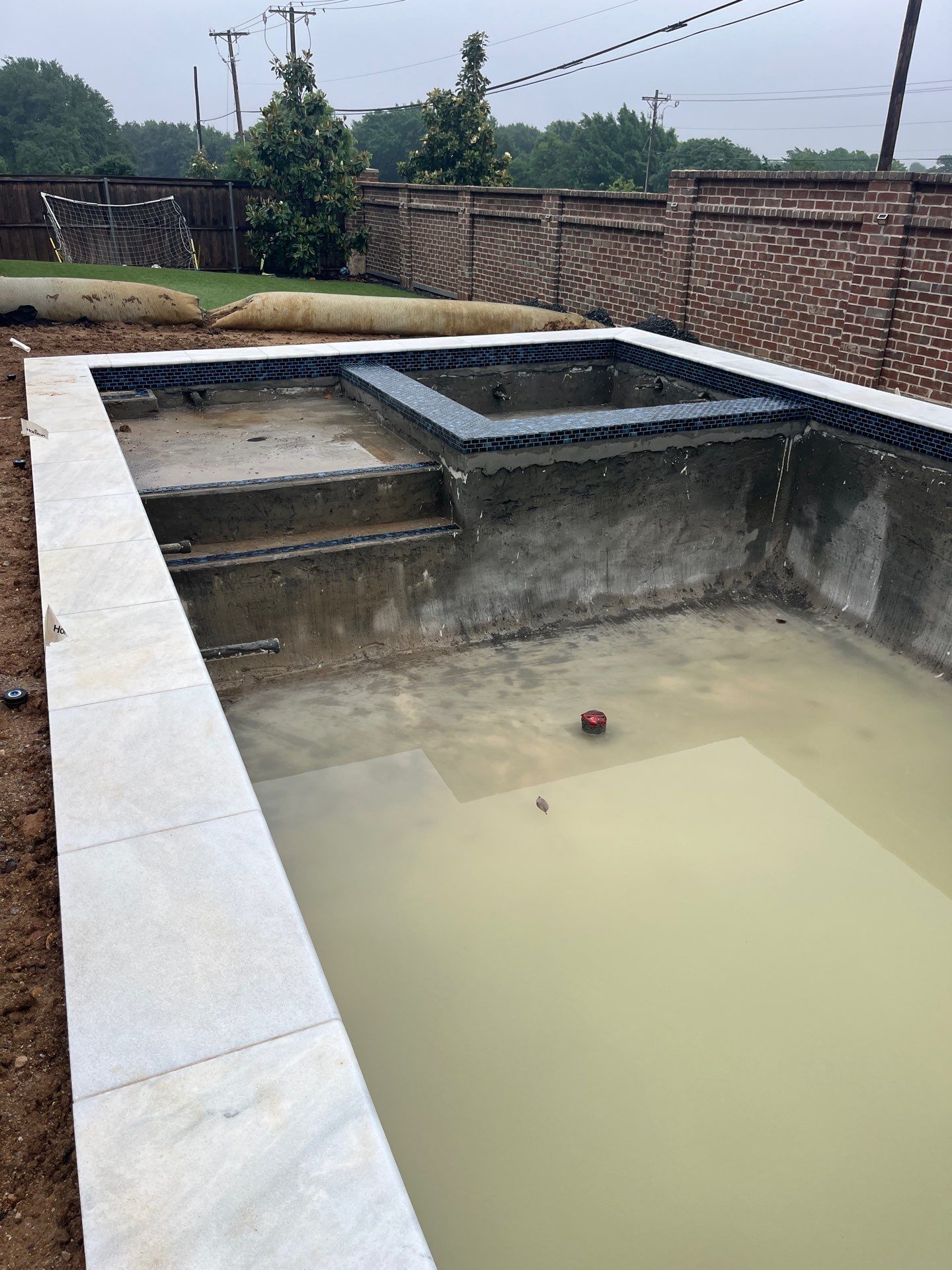 Modern Geometric Pool with Raised Spa and Turf Surround by Pinnacle Pools and Spas - DFW
