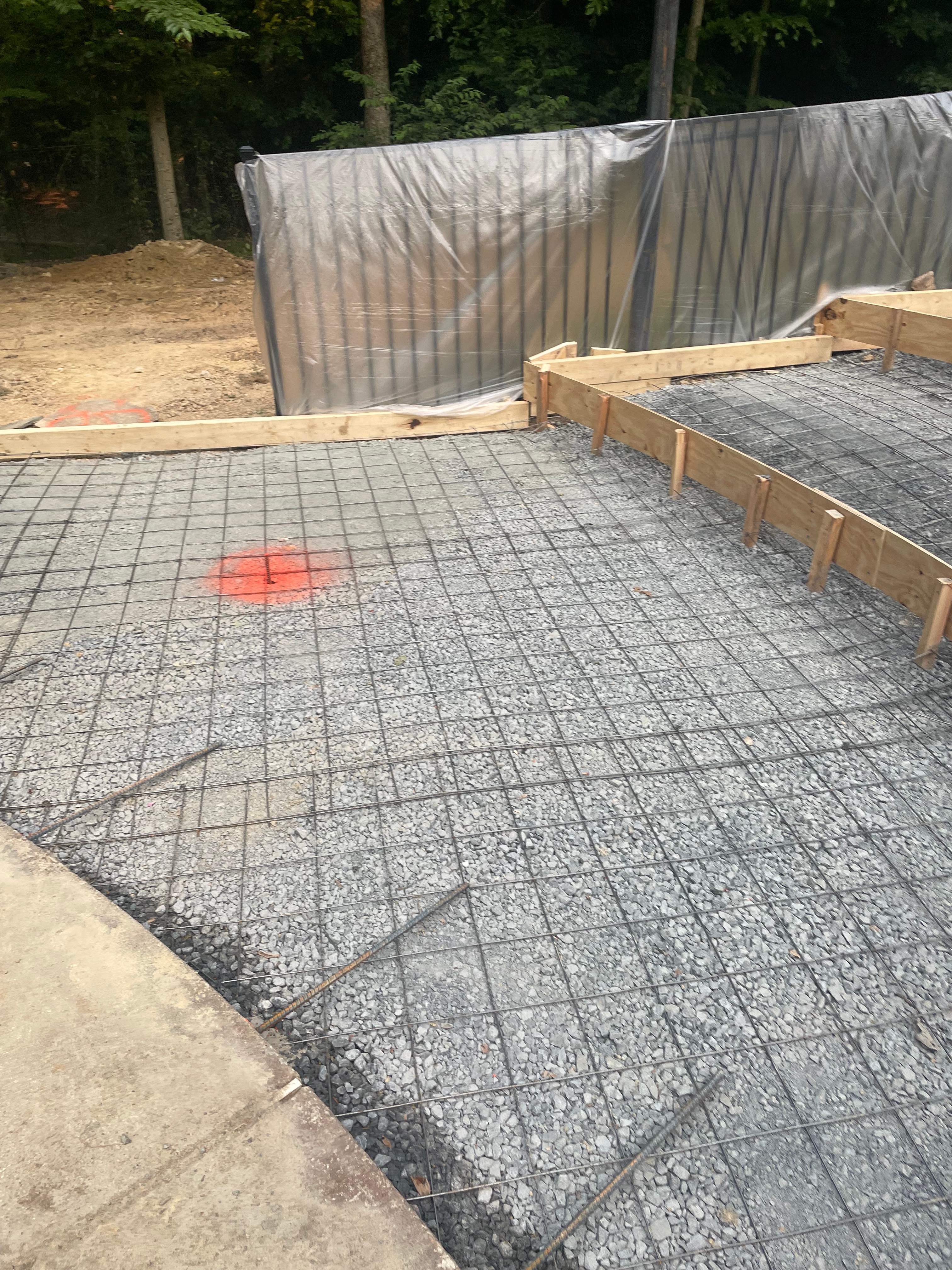 Pool Surround remodel with retaining walls, new waterfall and water slide by Fairfax Contractors, LLC