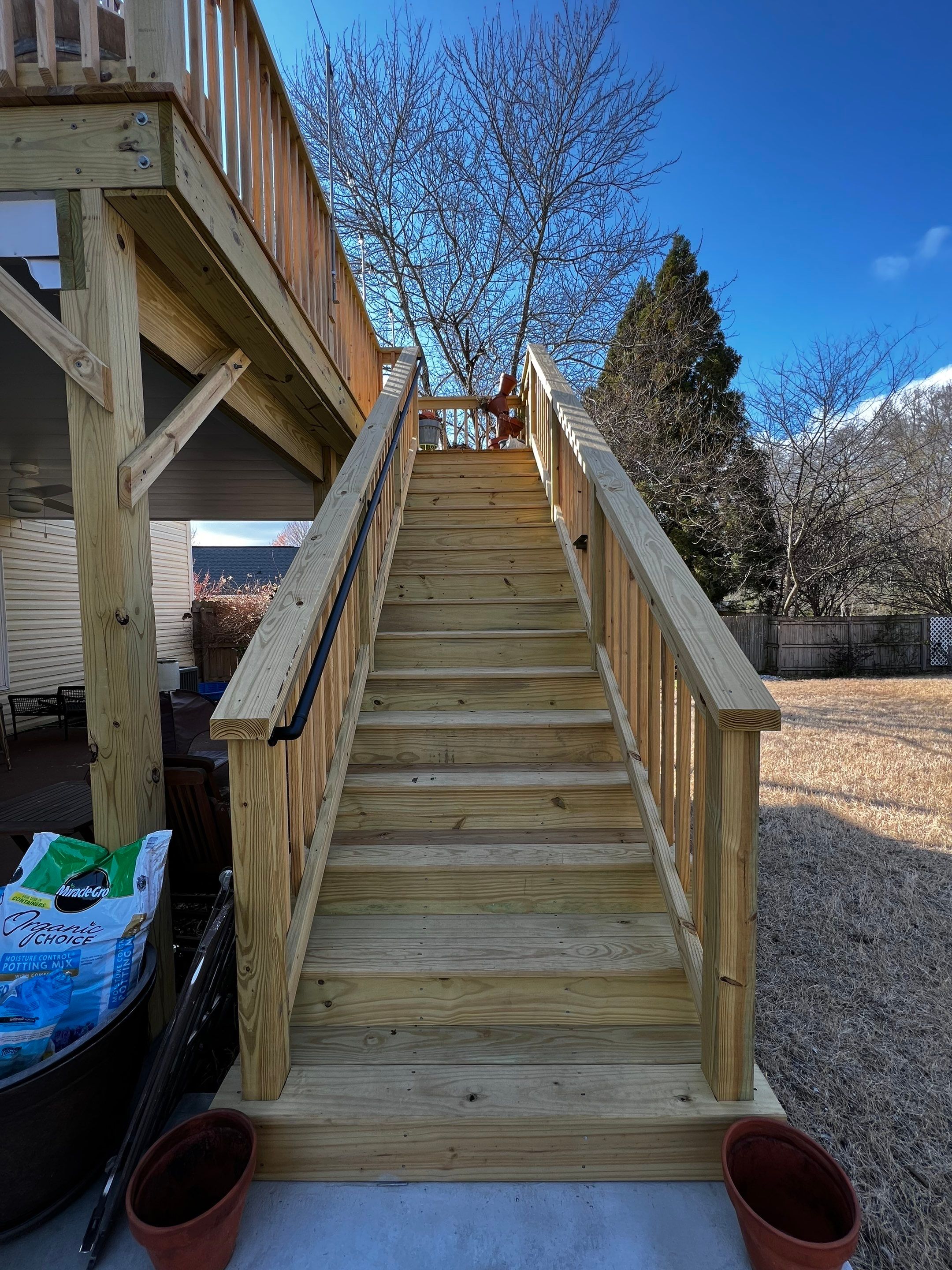 Elevated Wooden Deck Replacement and Under-Deck Ceiling in Cartersville by Swift Home Renovations