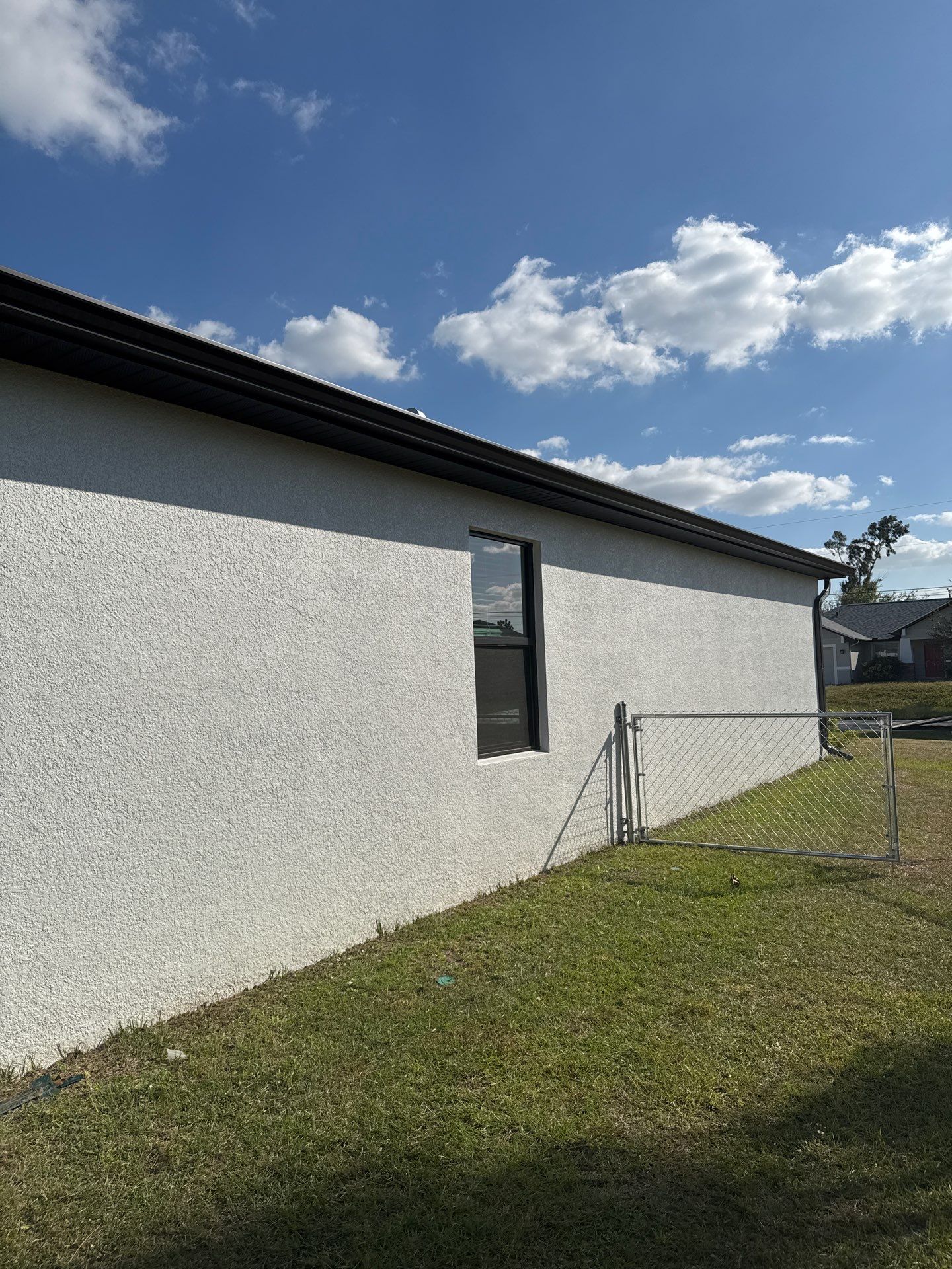 Dark Seamless Gutters and Downspouts in Cape Coral FL by Gutter Professors