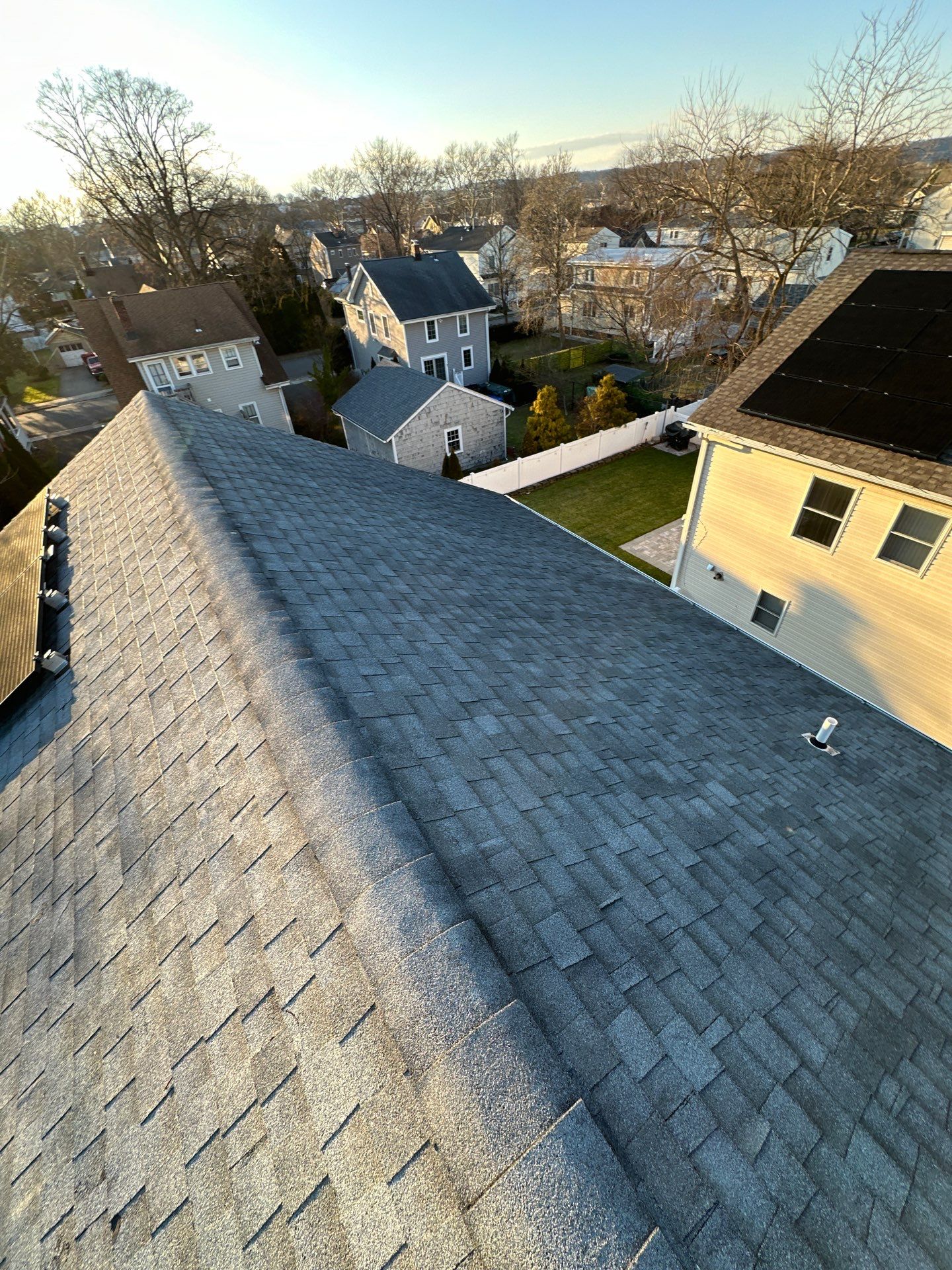 Charcoal Shingles by Reimagine Roofing