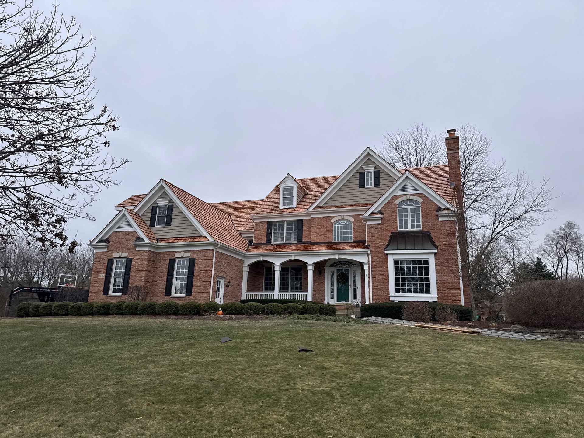 Re-roof: Cedar Shake & Custom Copper by Midwest Building Solutions