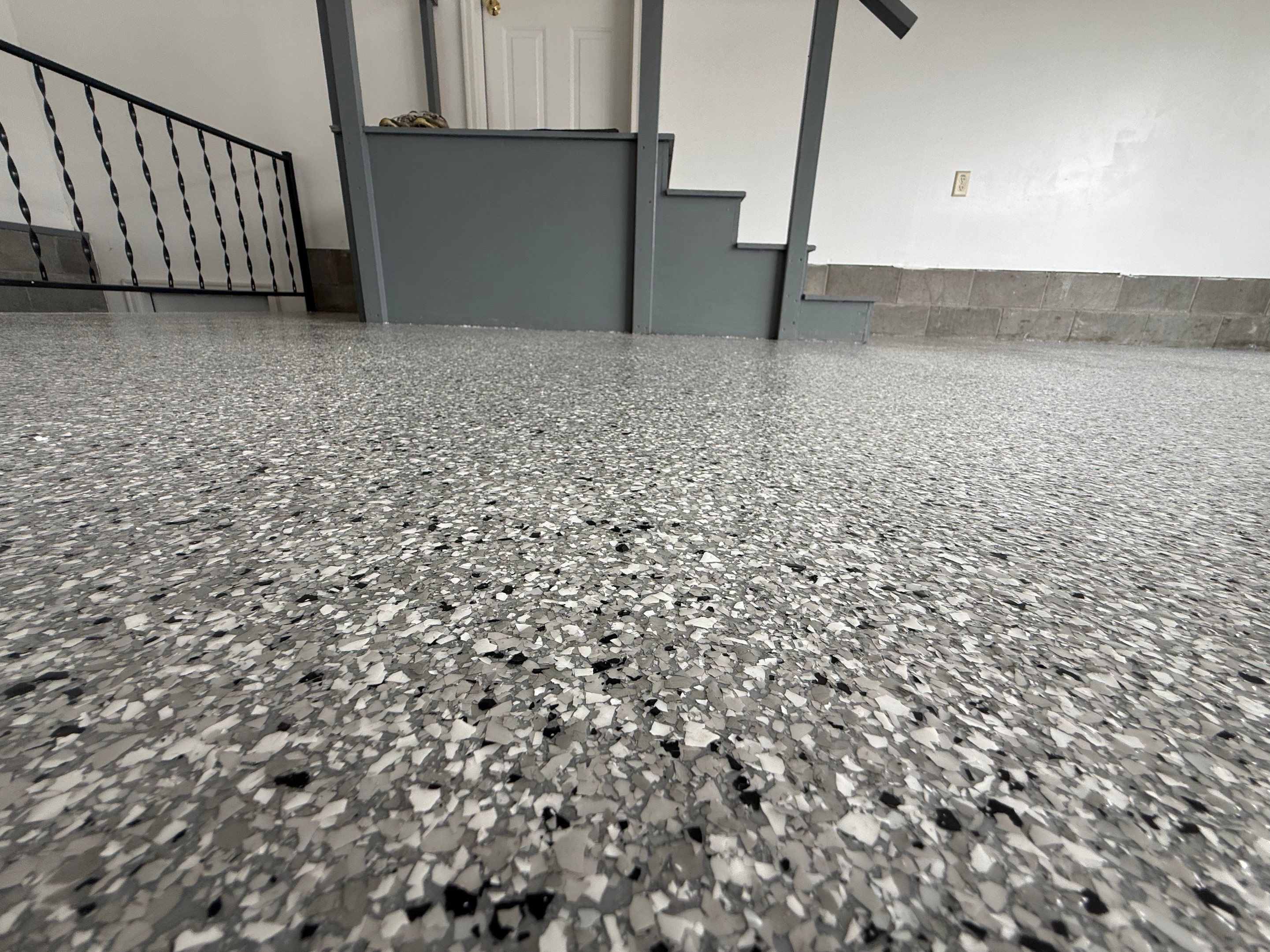 Feather Grey Garage Floor Coating and Concrete Restoration in Mitchell by Select Painting, Coatings & Garage Cabinets
