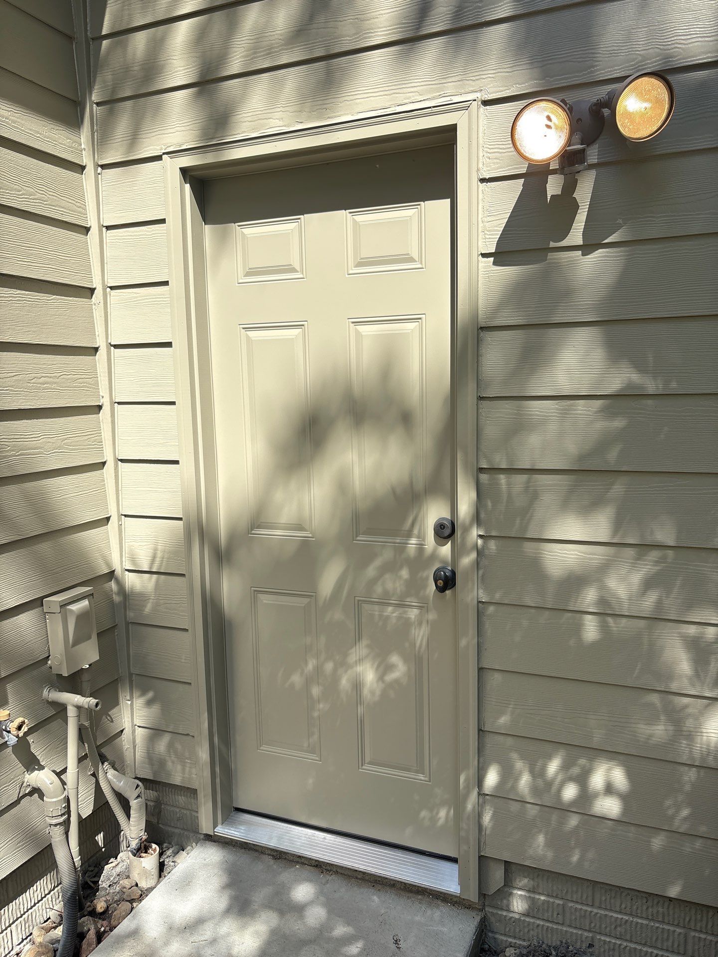 Sioux Falls Concrete Driveway Replacement and Custom Front Walkway by Select Painting, Coatings & Garage Cabinets