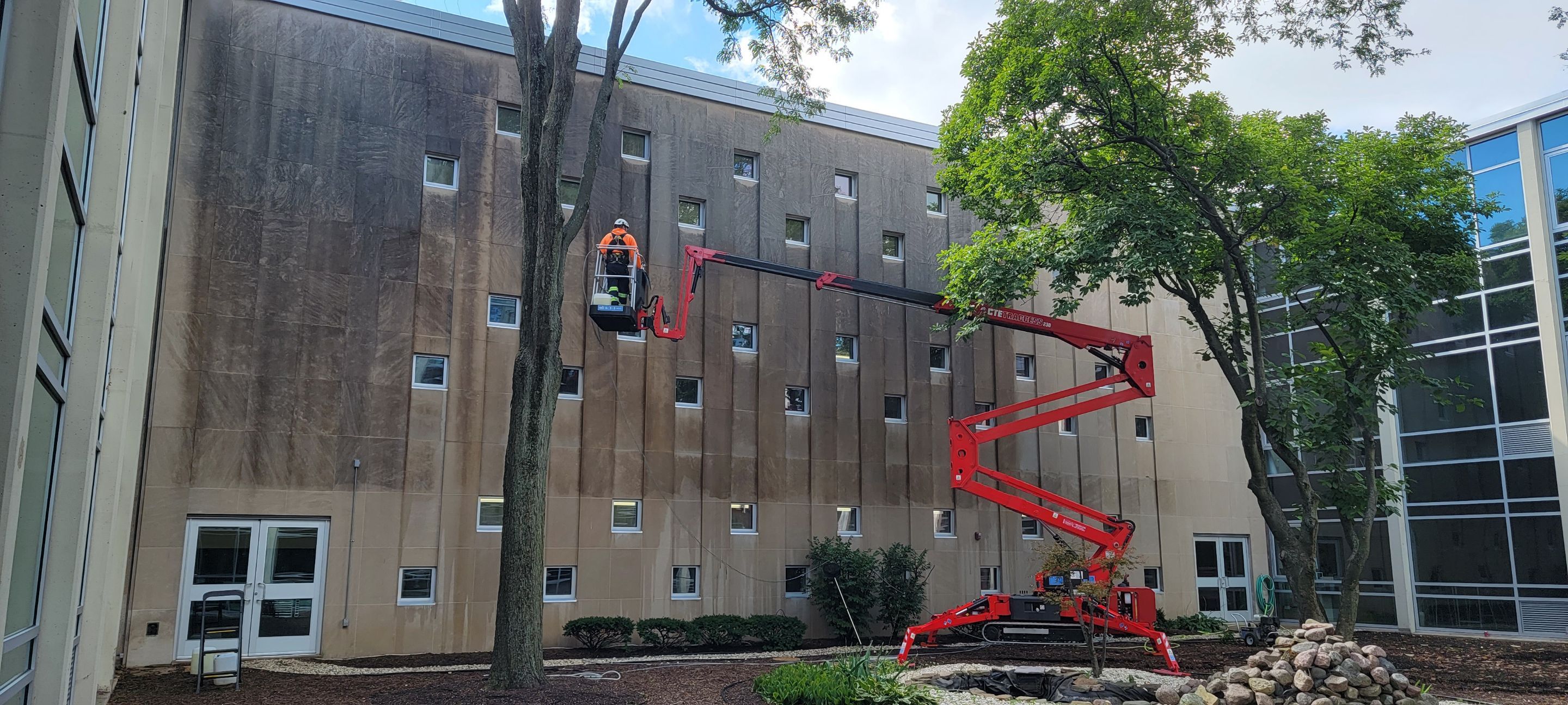 Courtyard pressure washing difficult access.  by Northern Power Washing LLC.