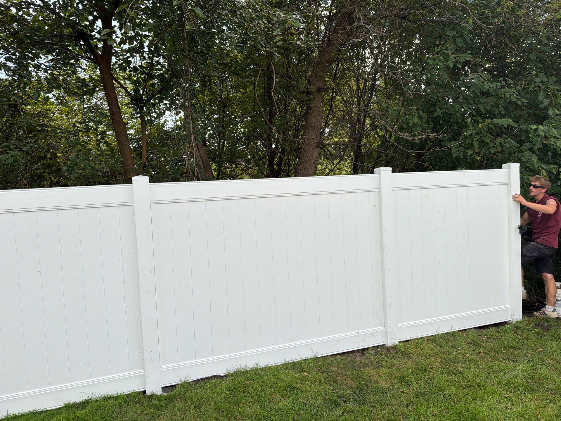 White Vinyl Privacy Fence Installation in Raymond, IA by Perfect Picket Fence and Stain