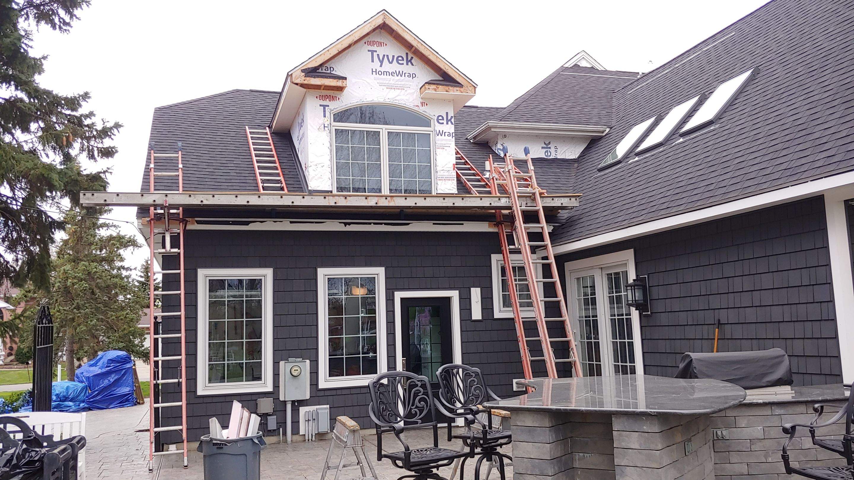 Exterior Renovations- Siding, Concrete, Railings, and Entry Door  by Ivy Lea Construction