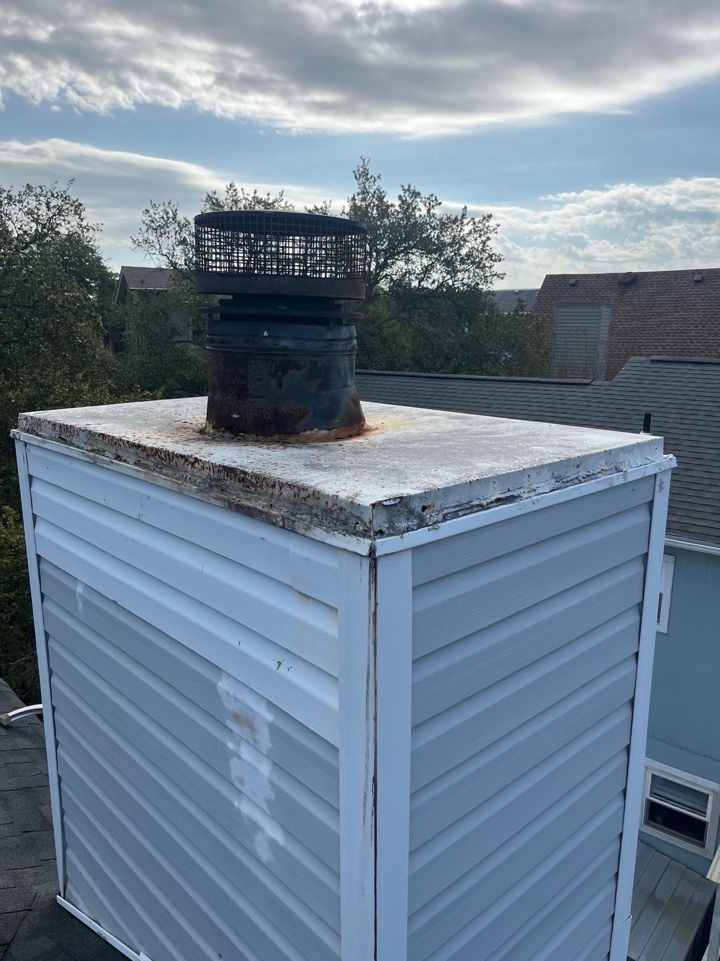 Chimney Leak Repair - Chase Cover, Cap, and Siding by Premier Chimney and Roofing