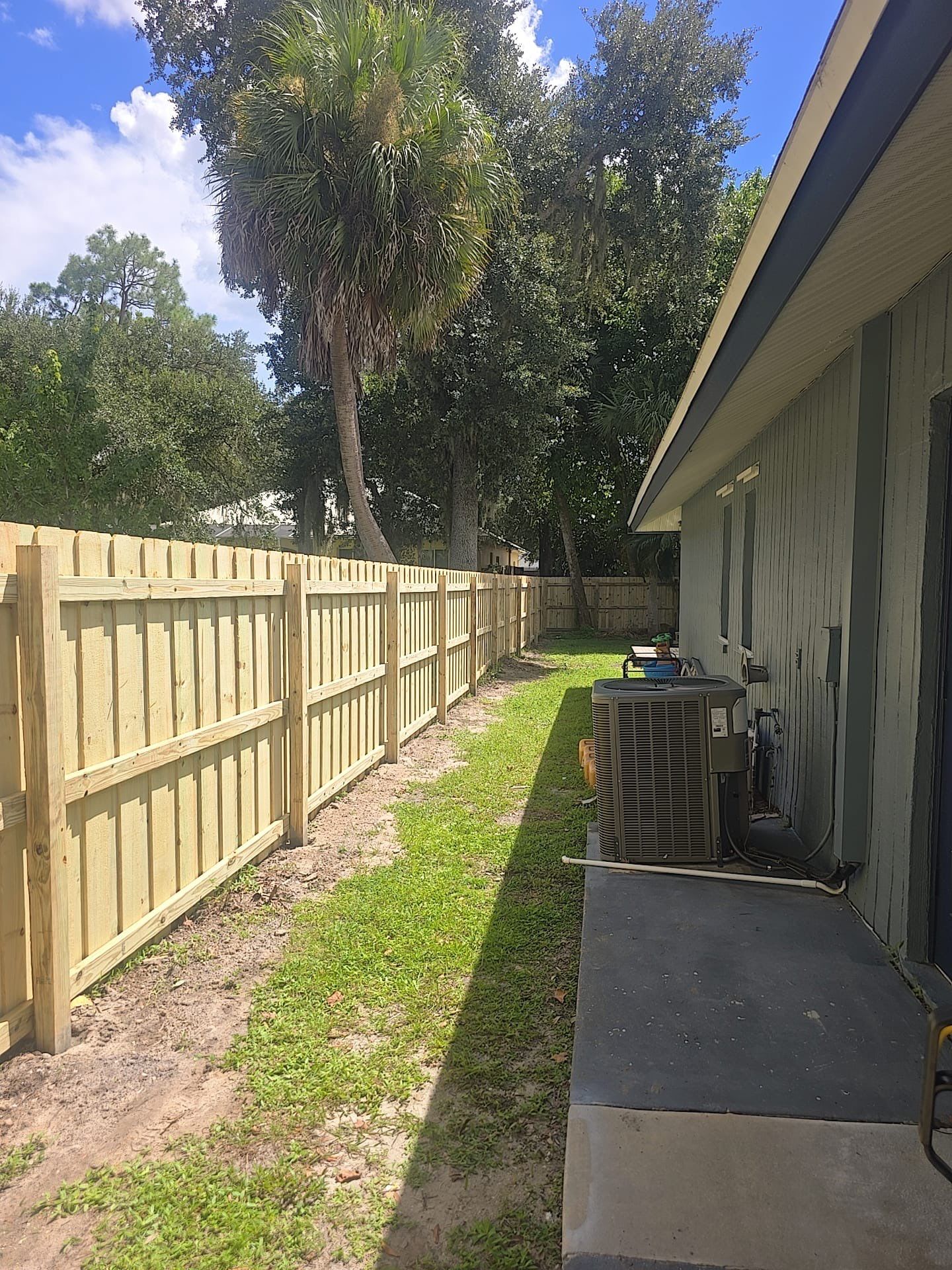 Wood Privacy Fence Installation with Double Gate in Port Charlotte by True Fence LLC