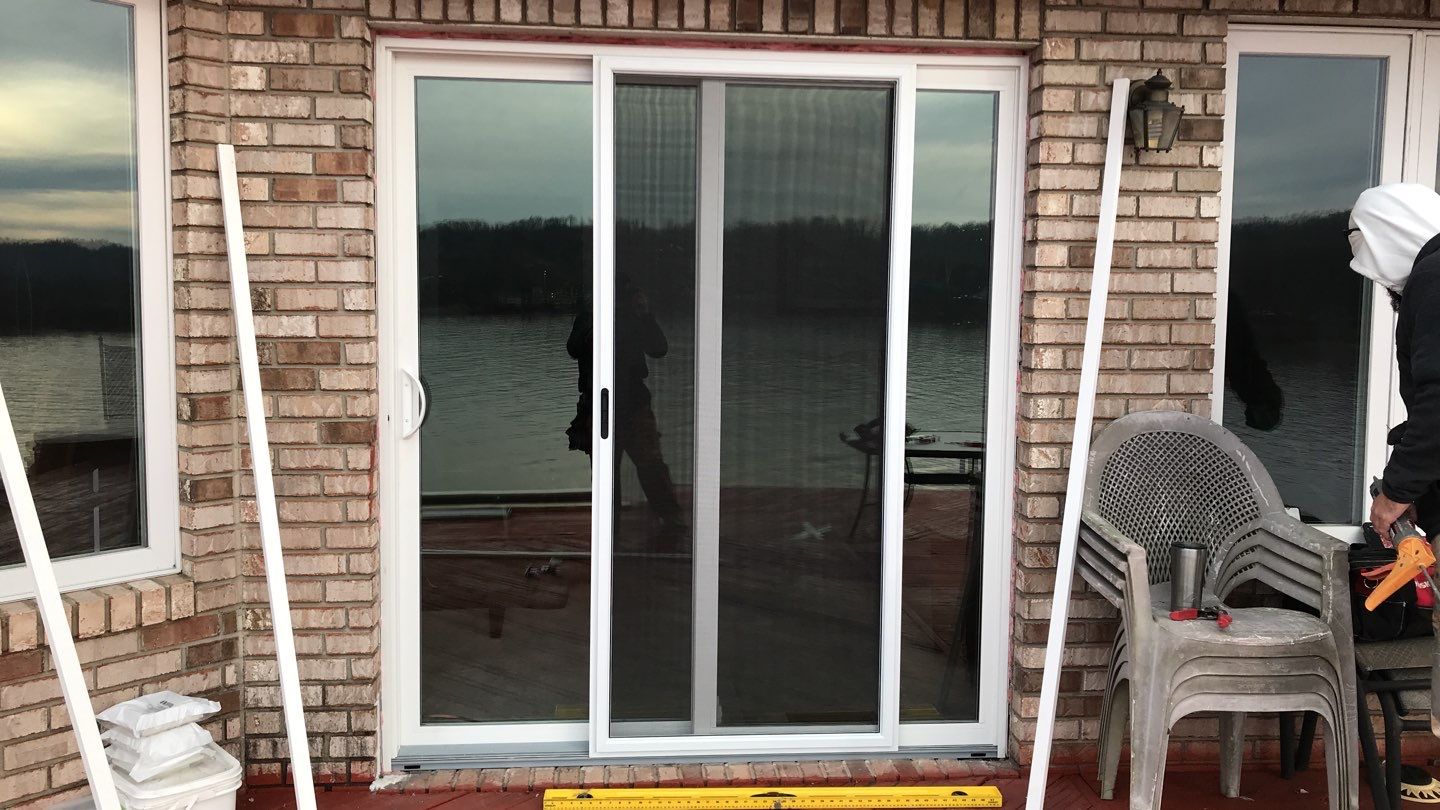 Deck Refurbush and Door Replacement using Trex Decking and Railing.  Polaris Patio Doors by Secure Construction Company Inc