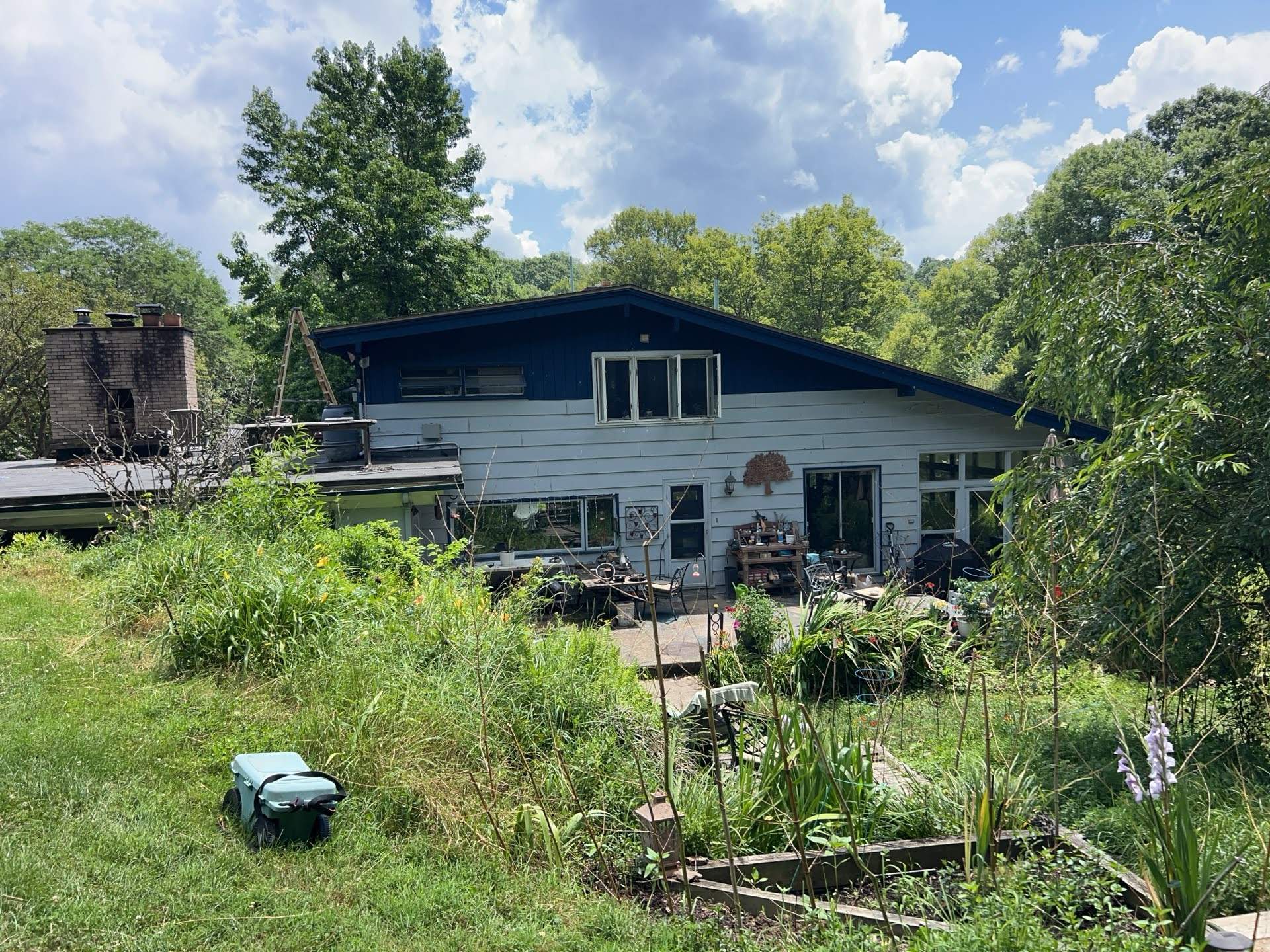 Two-Tone Siding and Sunroom Exterior Remodel in Beaver Falls by Ideal Siding Pittsburgh