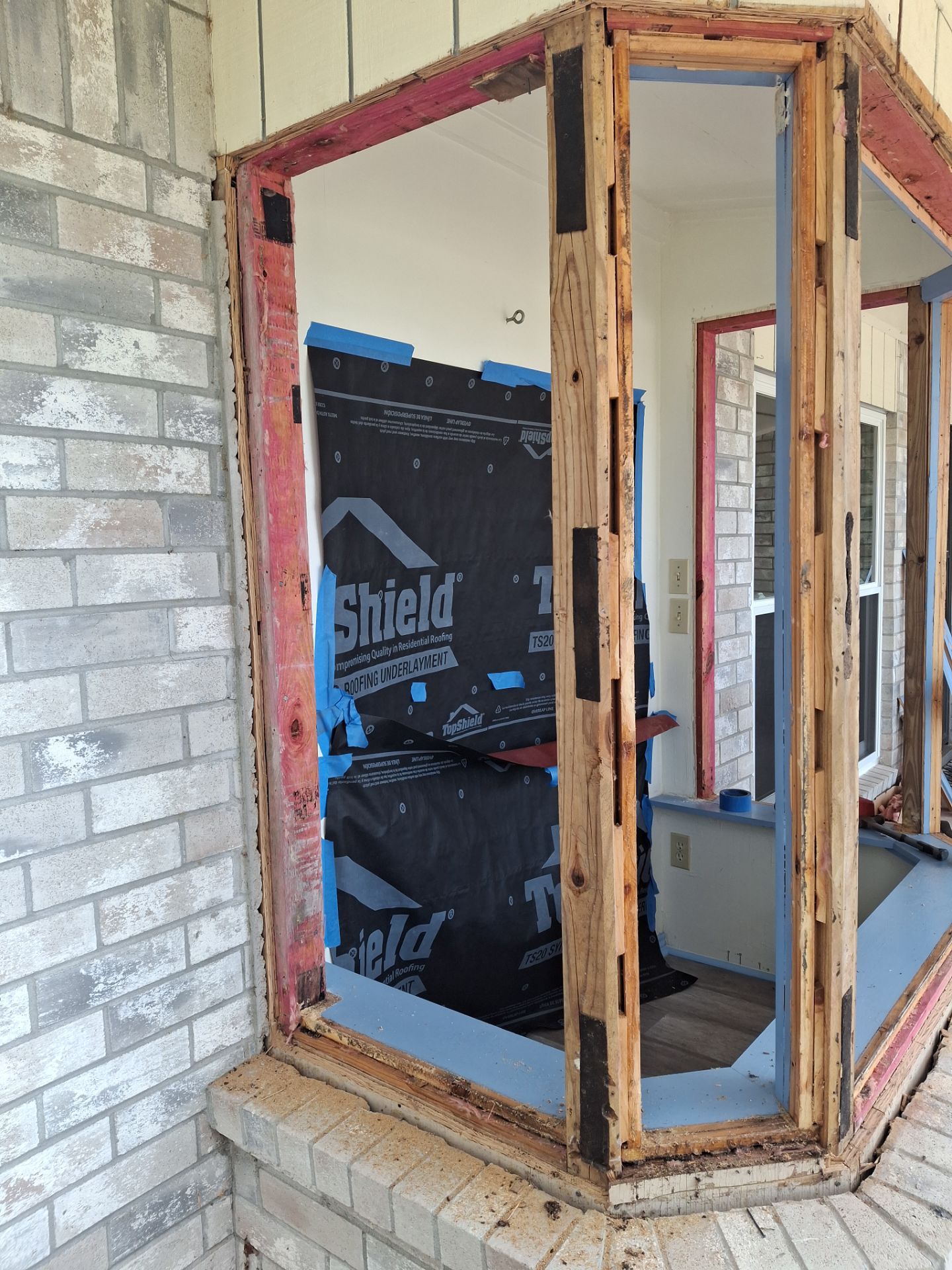 Installing Windows on a Submarine  by Bayfront Roofing and Construction