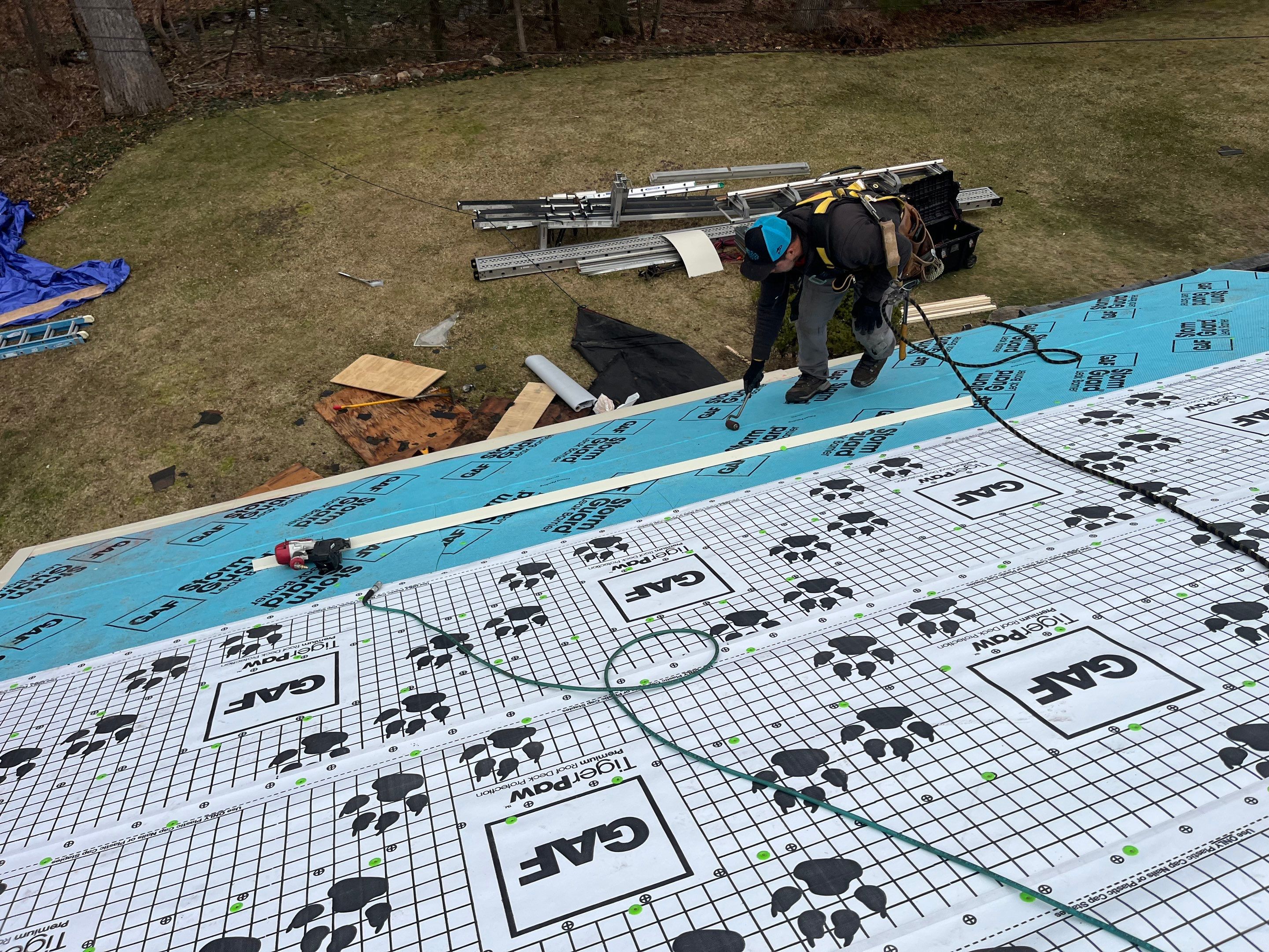Asphalt shingles meet sleek siding in Guilford. by DiGiorgi Roofing and Siding Inc
