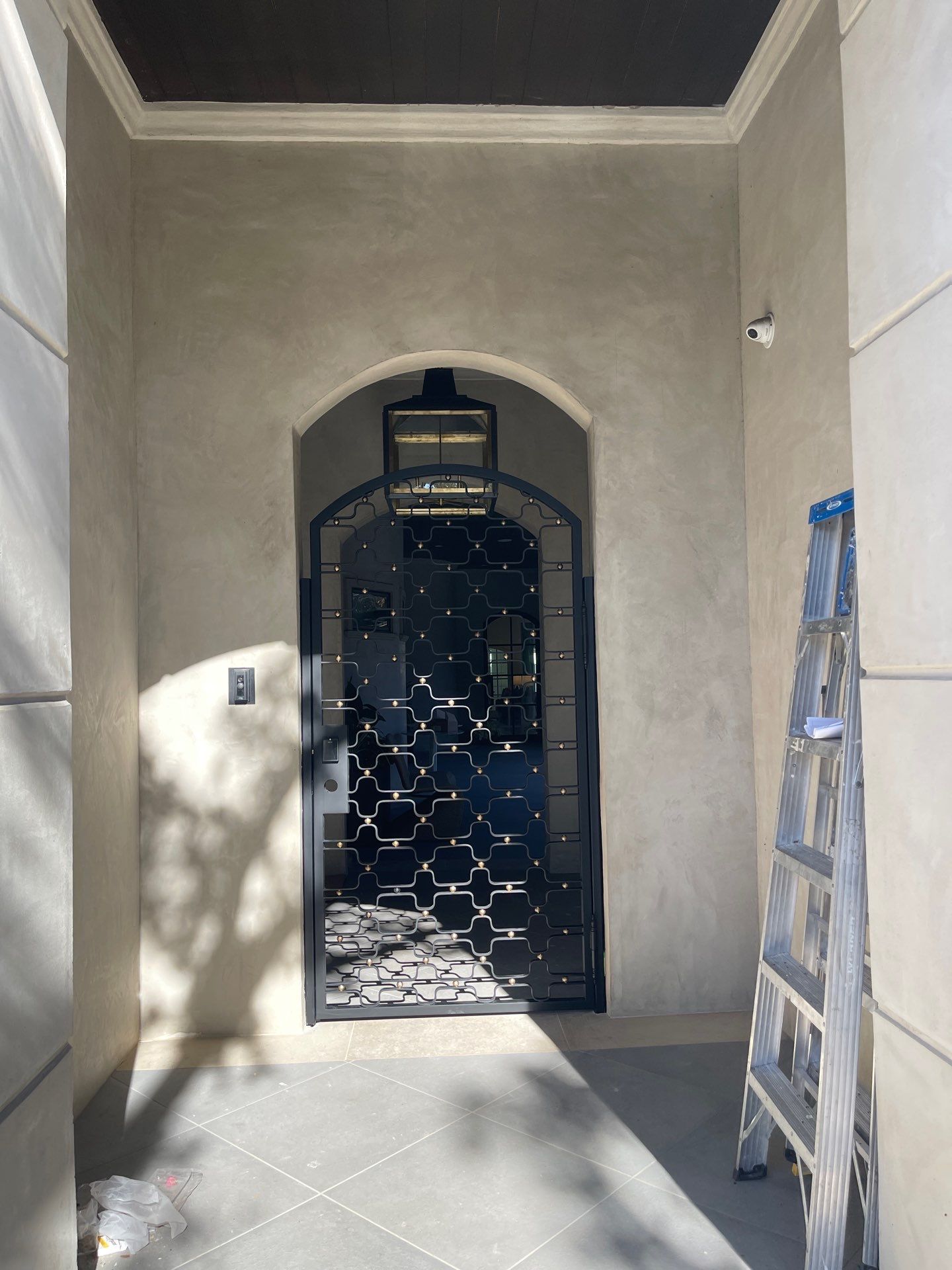 Arched Decorative Metal Security Gate Installation in Dallas by Solara Custom Living