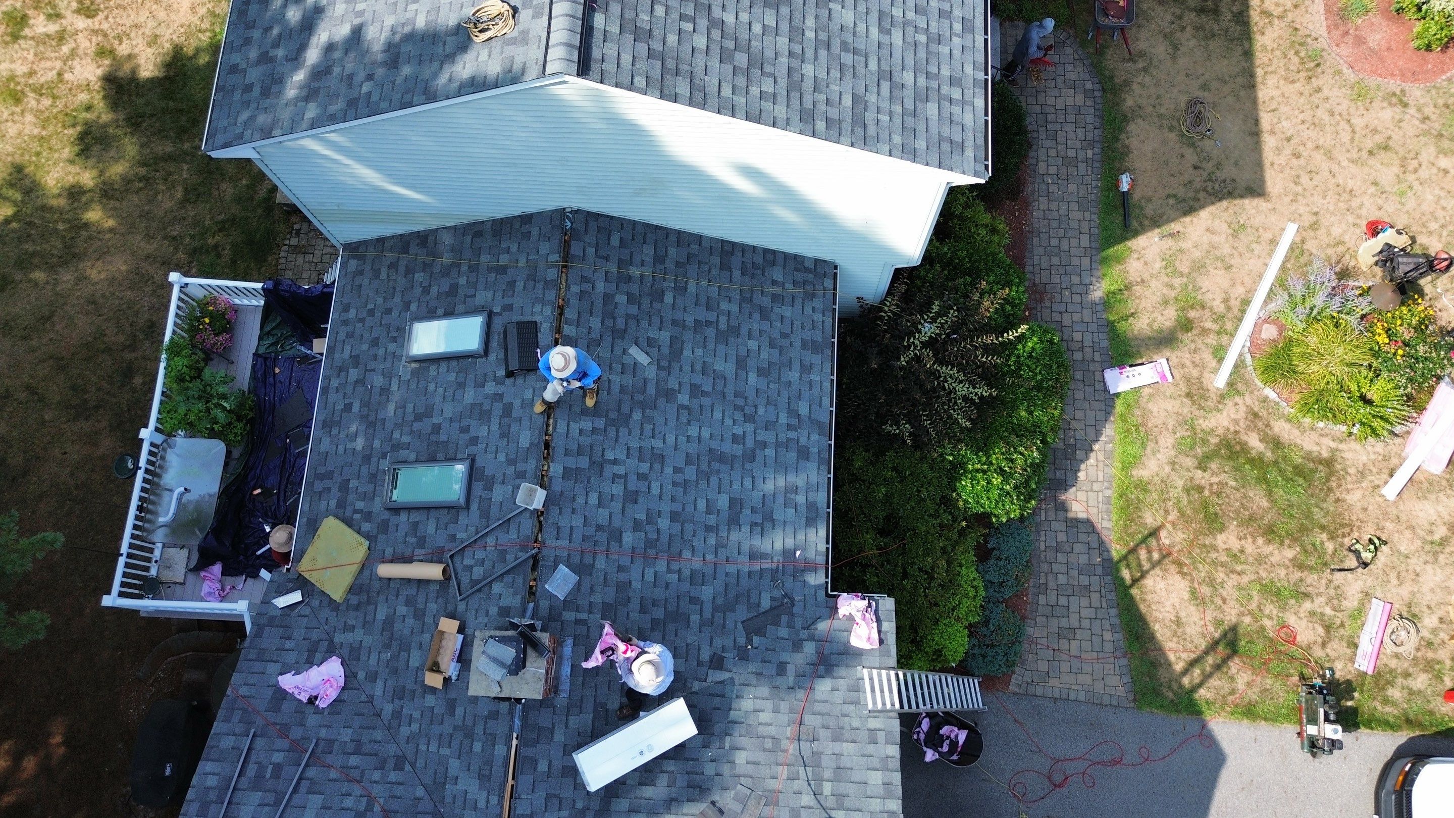 Complete Roof Replacement with Chimney Flashing, Gutter Guard System, and Vinyl Siding Repairs by Mighty Dog Roofing of Greater Middlesex County