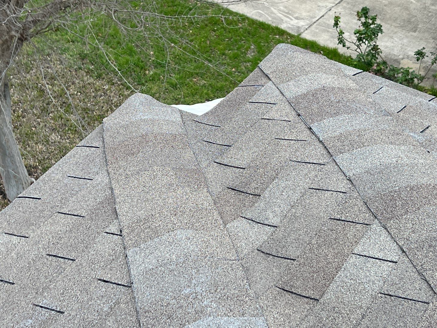 Wind damaged roof replacement by Oakwood Roofing and Construction, LLC