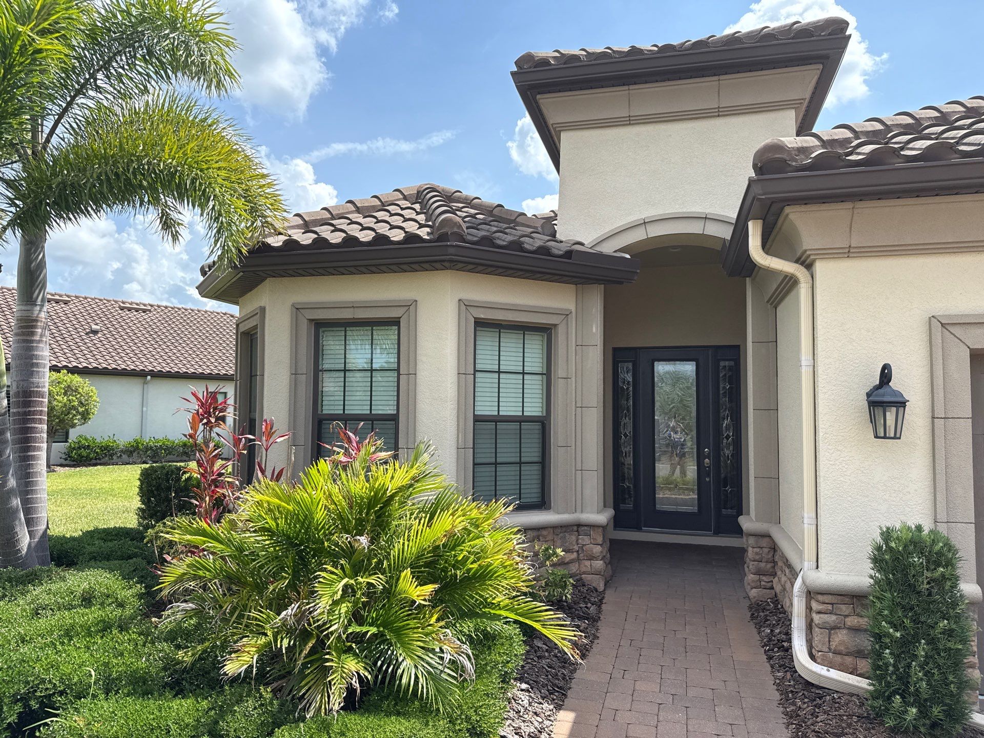 Concrete Tile Roof, Paver Driveway & Lanai Cleaning – Artisan Lakes Esplanade, Palmetto, FL by Sunshine AquaWash