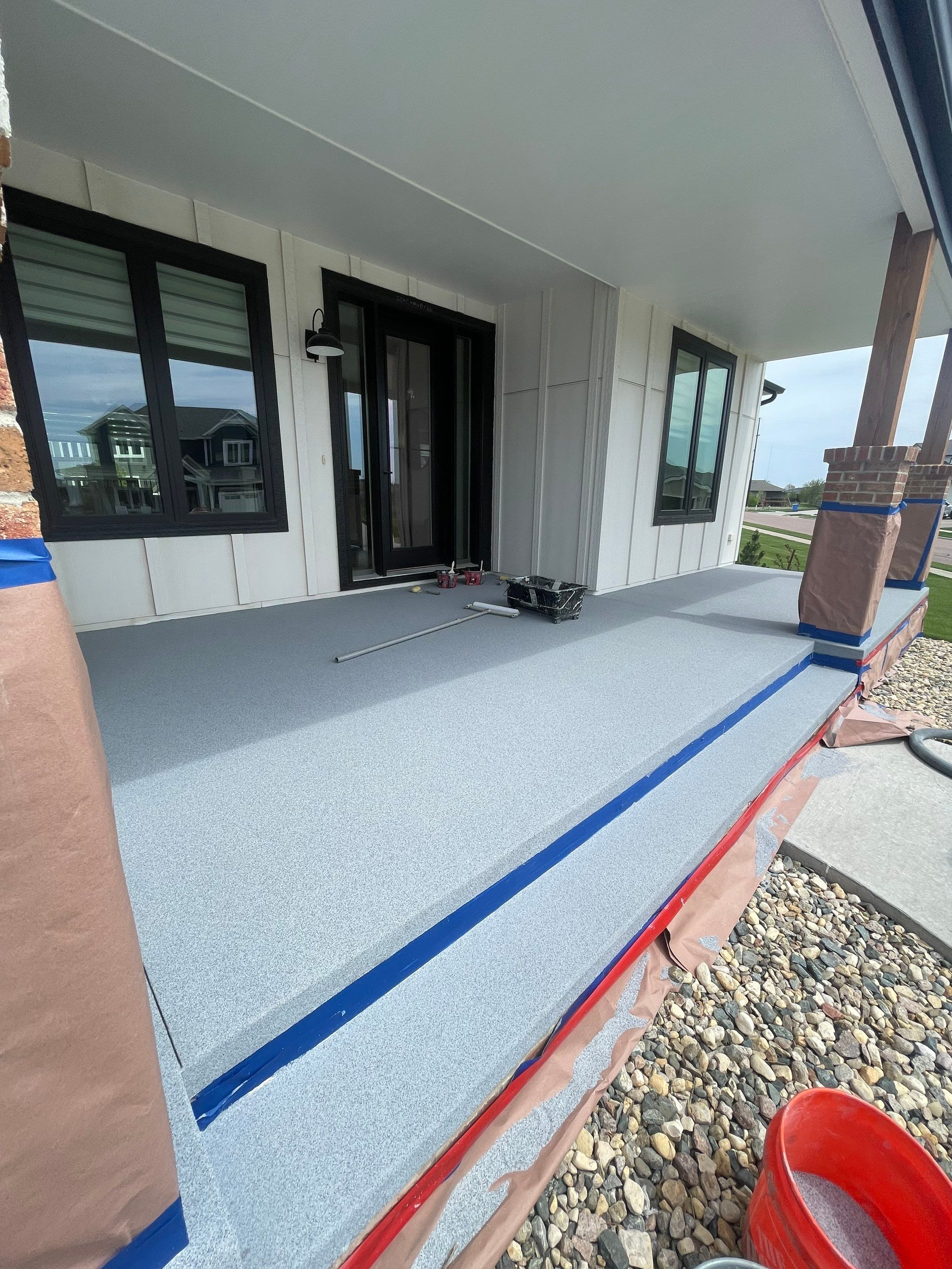 Grey Speckled Concrete Porch Coating for Sioux Falls Home by Select Painting, Coatings & Garage Cabinets