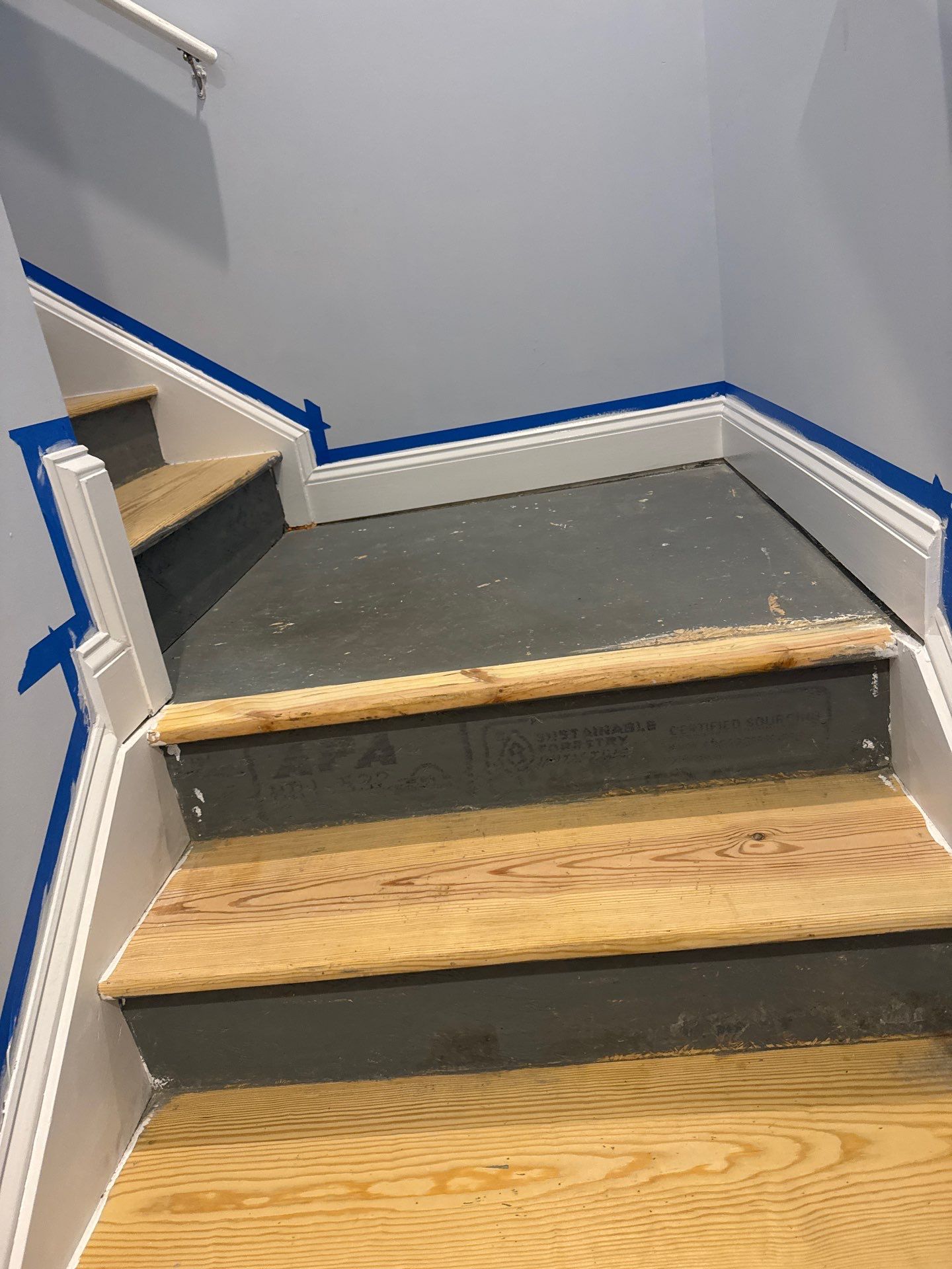 Stairway Installation using t vinyl stair tread and reversibleriser by La Bendicion Contruction Llc