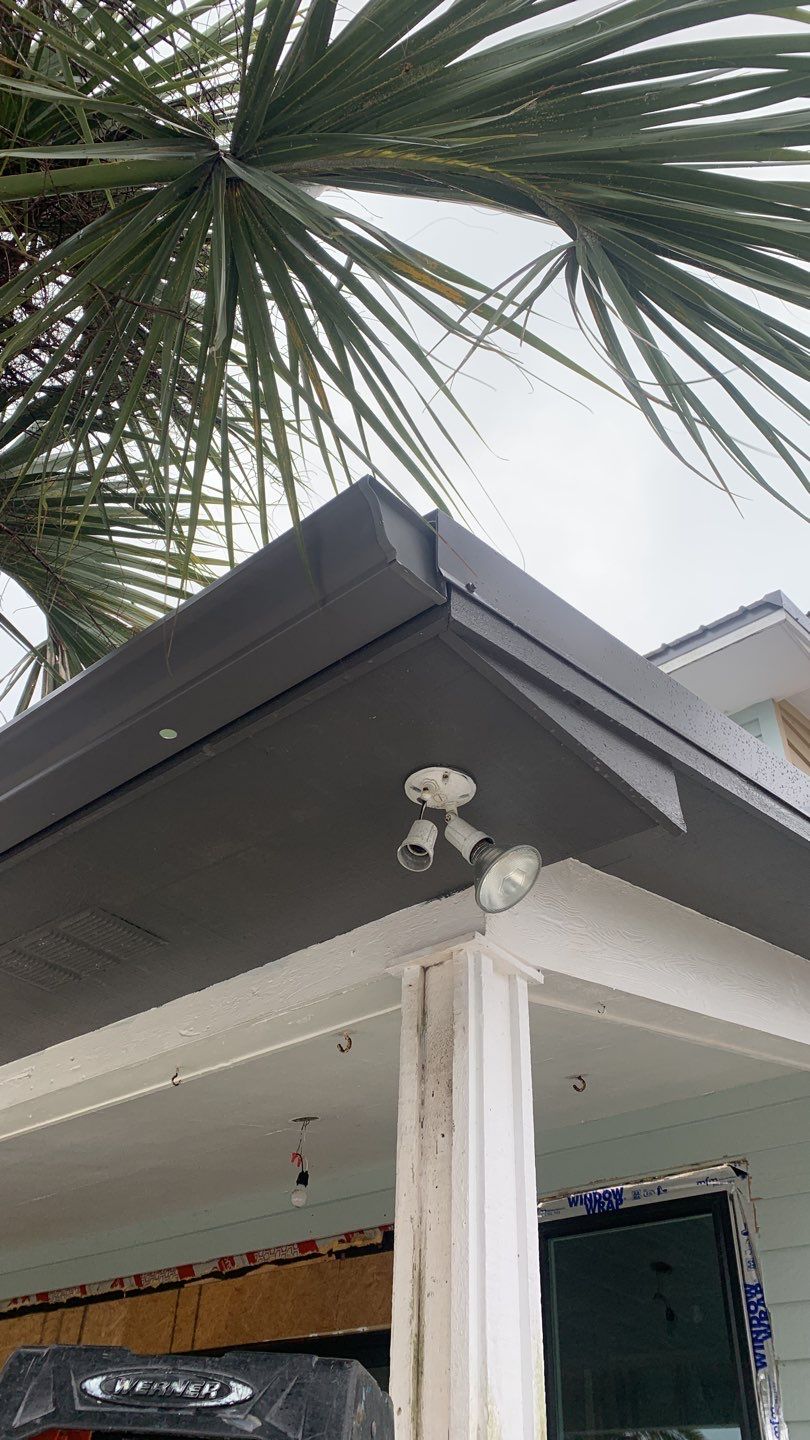 Seamless Gutter Installation using Charcoal Grey Gutters by Gutter Professors