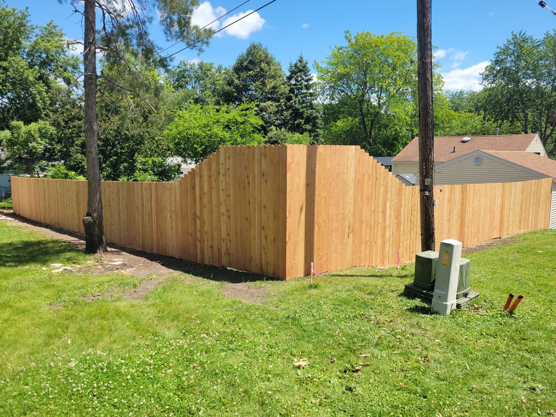 Custom Cedar Unstained Wood Privacy Fence Installation in Cedar Falls by Perfect Picket Fence and Stain