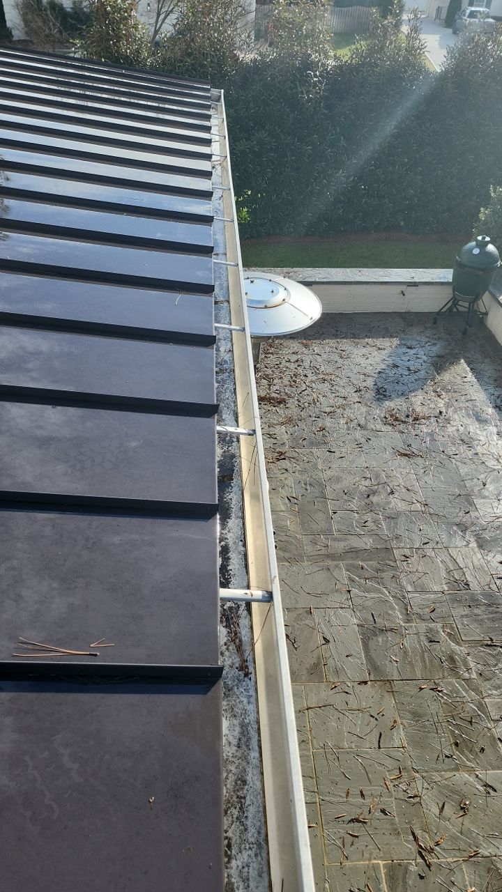 Gutter Cleaning using water by Power Wash Masters LLC