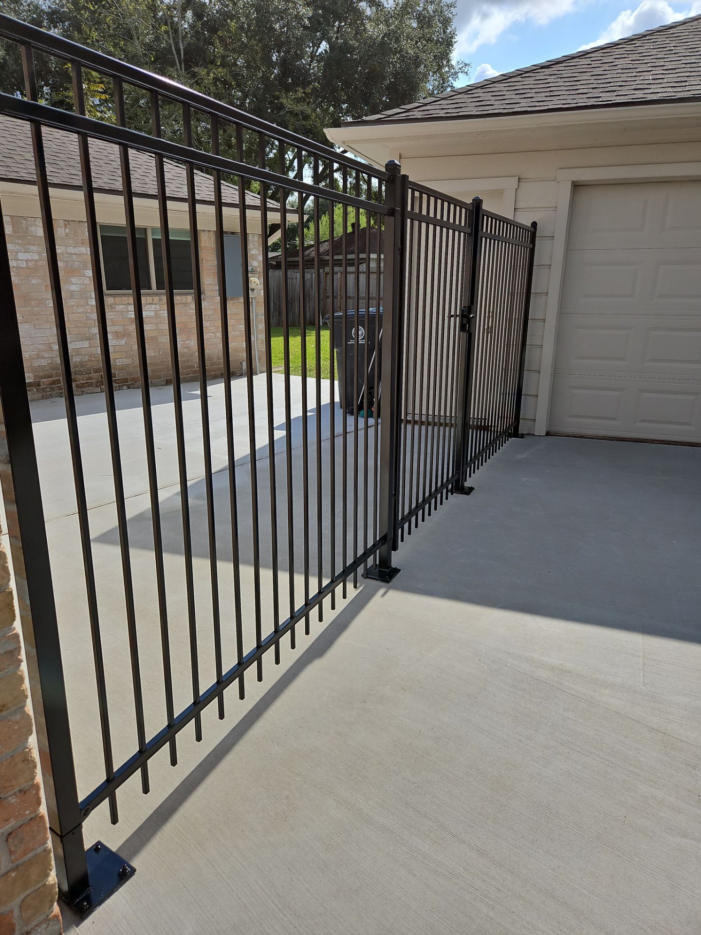 Iron fence installation using 6ft - 3 Rail - Ameristar Montage by Tim's Fences