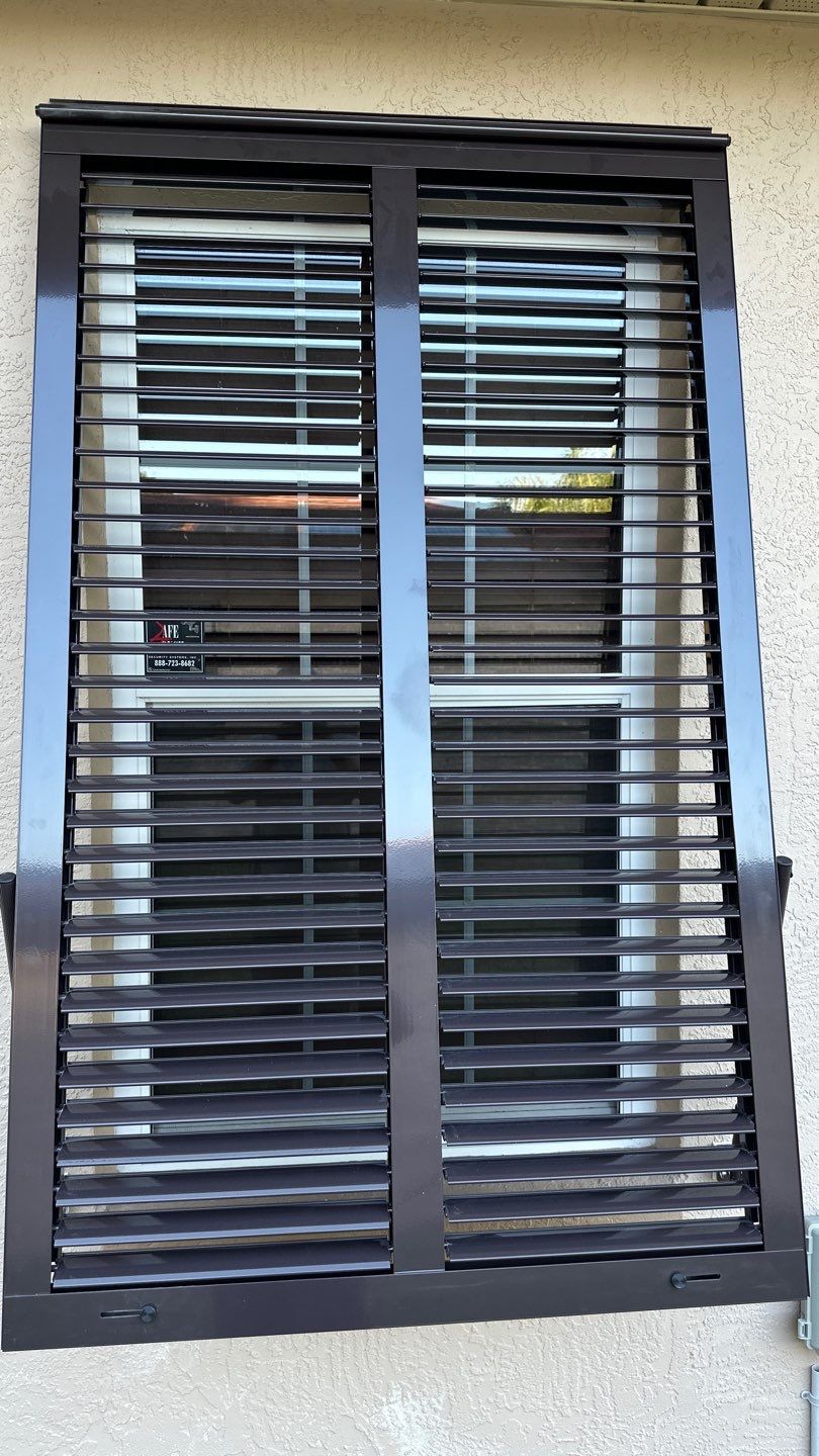 Hurricane Rated Bahama Shutters in Gray Brown by Smart Guard Shutters