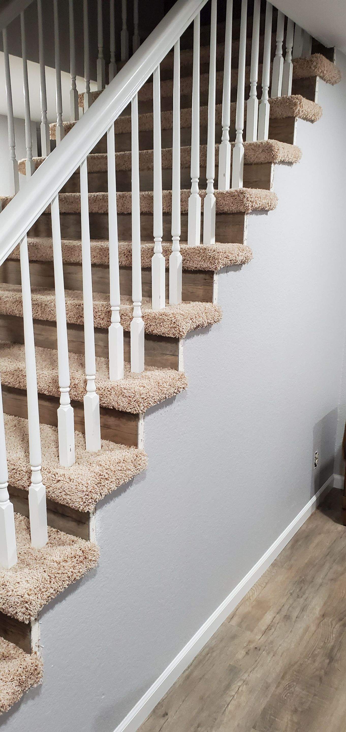 Carpet Install on Stairs with Spindles by Ardent Carpet Restore LLC