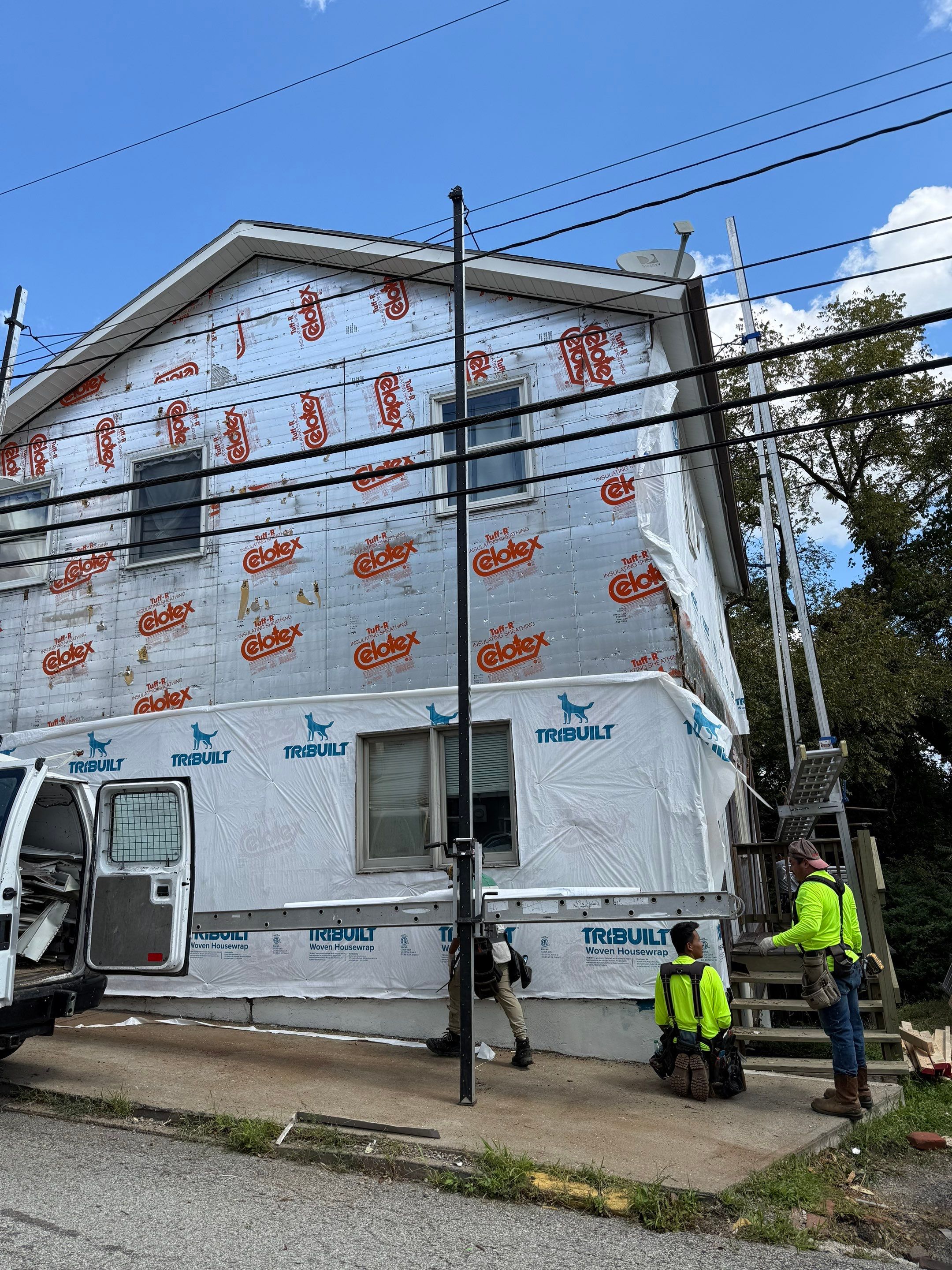 White siding  by Cousins Roofing Siding & Decks