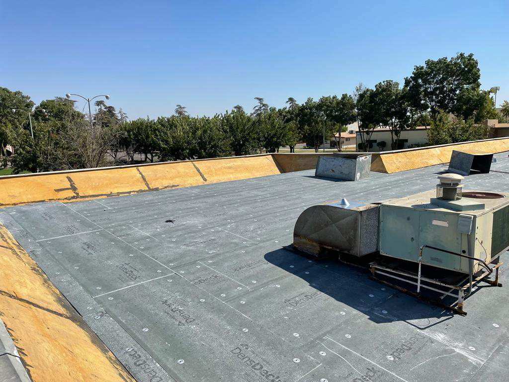Commercial Roofing Installation using General Coatings acrylic coatings and spray foam by Straight Edge Roofing Inc