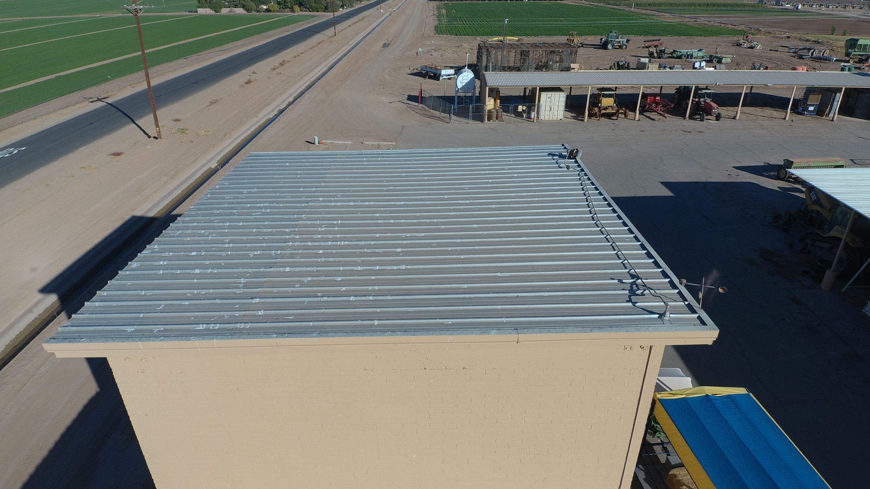 Metal roof restoration on commercial roof using Conklin Benchmark/PUMA XL fabric and coating by Straight Edge Roofing Inc