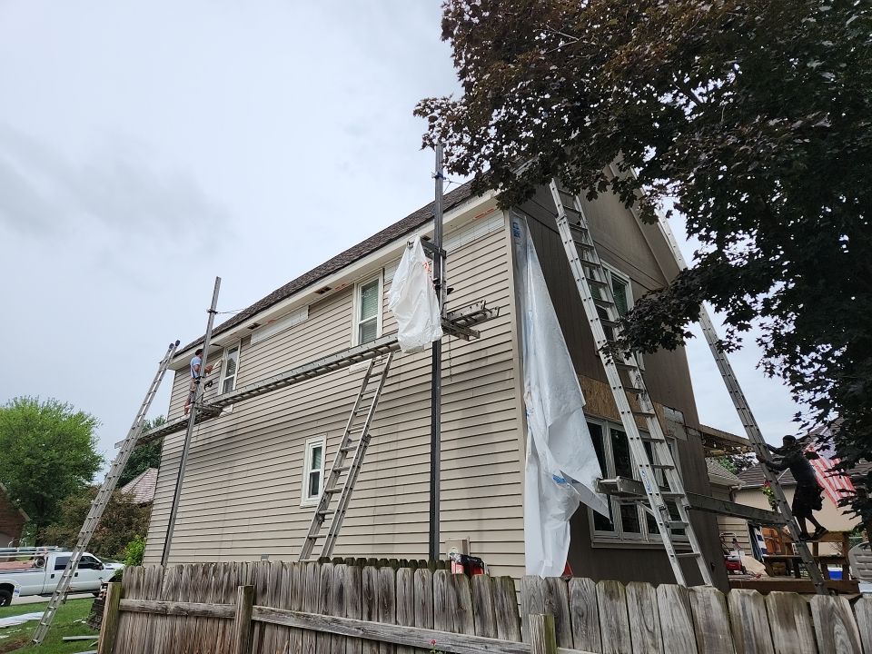 All New Craneboard D7 siding and New prefinished front door   by EEC  Windows, Siding & Roofing 